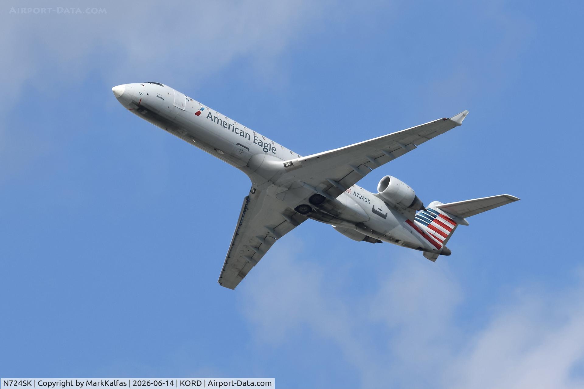 Aircraft N724SK, 2004 Bombardier CRJ-700 (CL-600-2C10) Regional Jet, c/n 10189, CRJ7 SkyWest / American Eagle Bombardier CRJ-700 N724SK departing 28R KORD, at KORD, photo by MarkKalfas