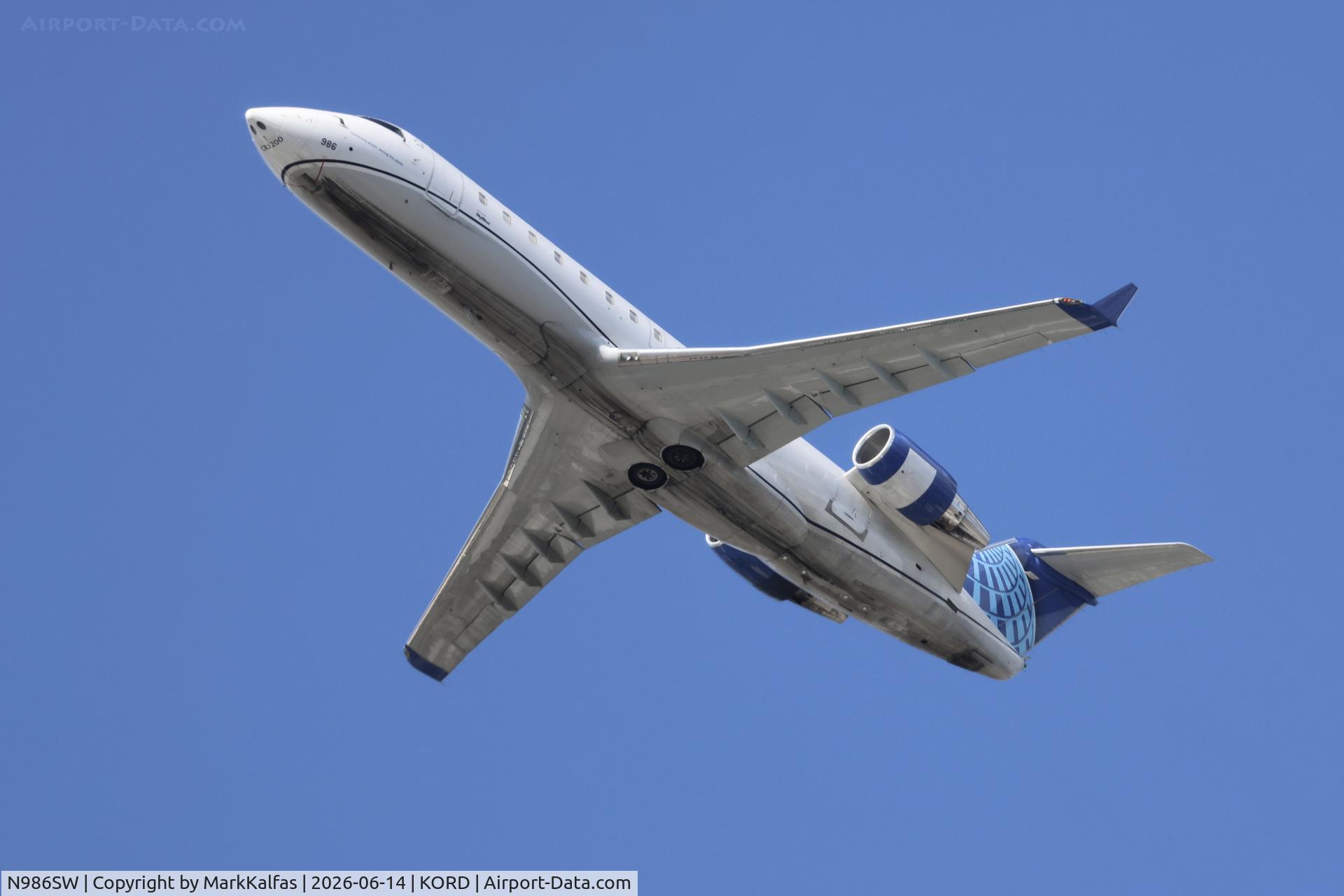 Aircraft N986SW, 2004 Bombardier CRJ-200ER (CL-600-2B19), c/n 7967, CRJ2 SkyWest / United Express Bomardier CRJ-200 N986SW departing 28R KORD, at KORD, photo by MarkKalfas