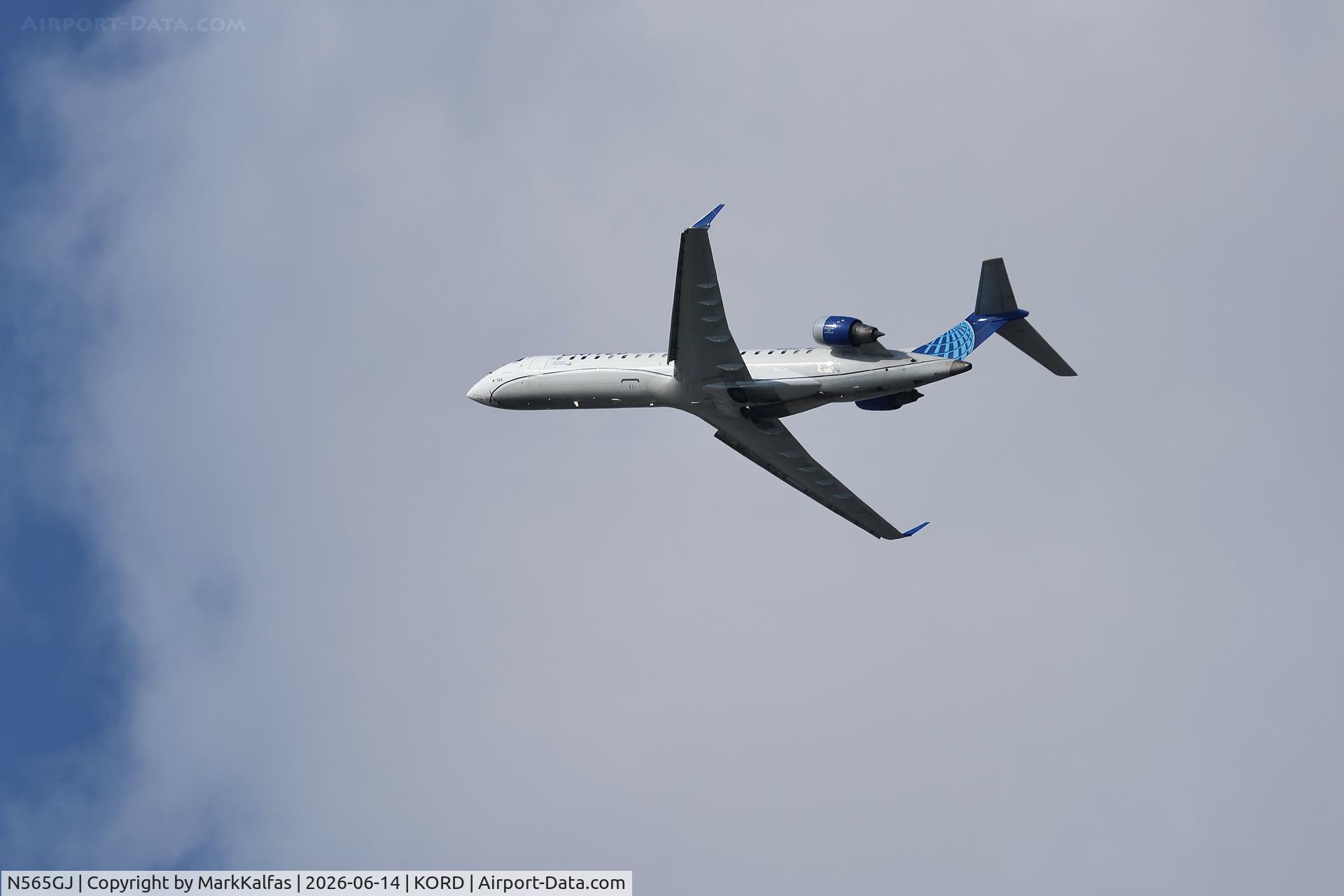 Aircraft N565GJ, 2003 Bombardier CRJ-700 (CL-600-2C10) Regional Jet, c/n 10087, CRJ7 GoJet/United Express Bombardier CRJ 550, N565GJ departing 28R KORD, at KORD, photo by MarkKalfas