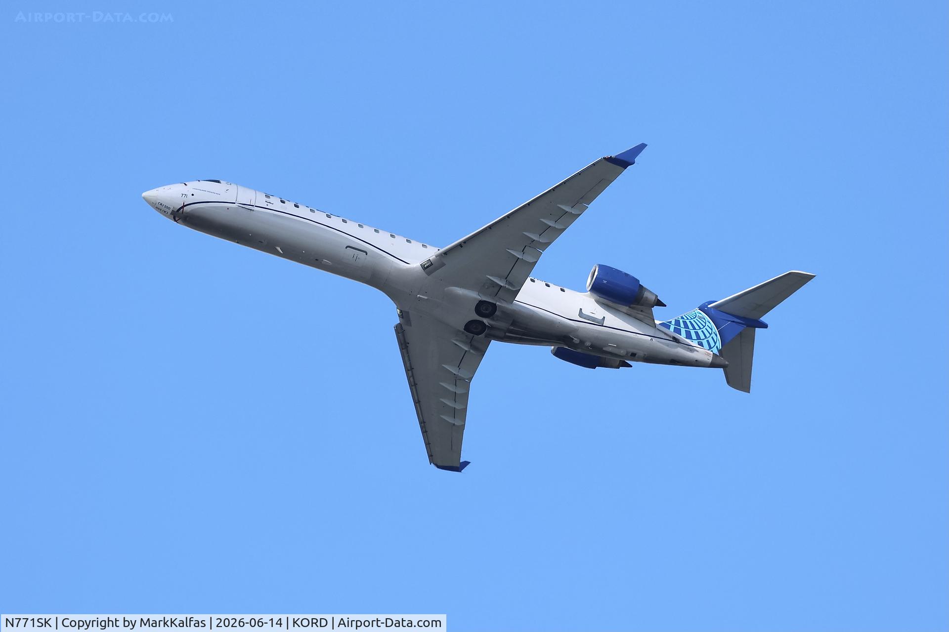 Aircraft N771SK, 2006 Bombardier CRJ-700 (CL-600-2C10) Regional Jet, c/n 10244, CRJ7 SkyWest/United Express Bombardier CRJ 550, N771SK departing 28R KORD, at KORD, photo by MarkKalfas