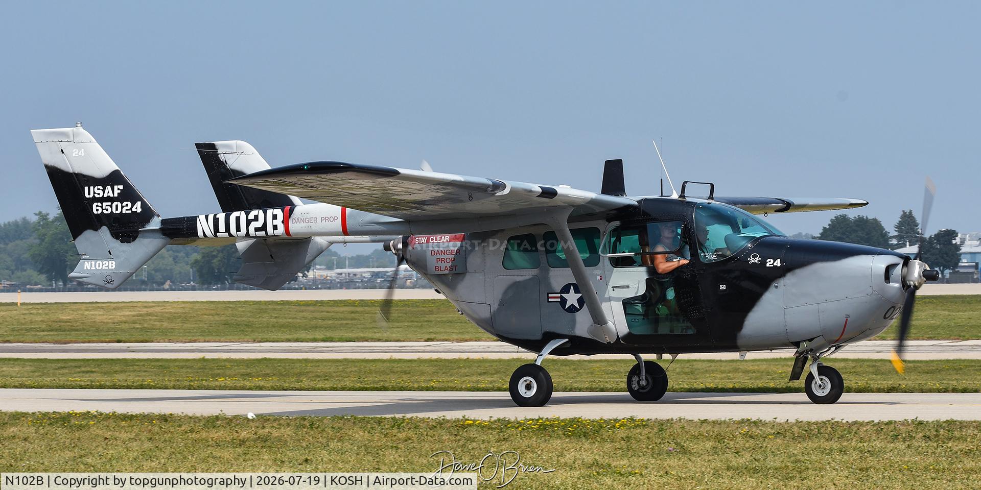 Aircraft N102B, 1965 Cessna 337 Super Skymaster, c/n 337-0024, Oshkosh 26, at KOSH, photo by topgunphotography
