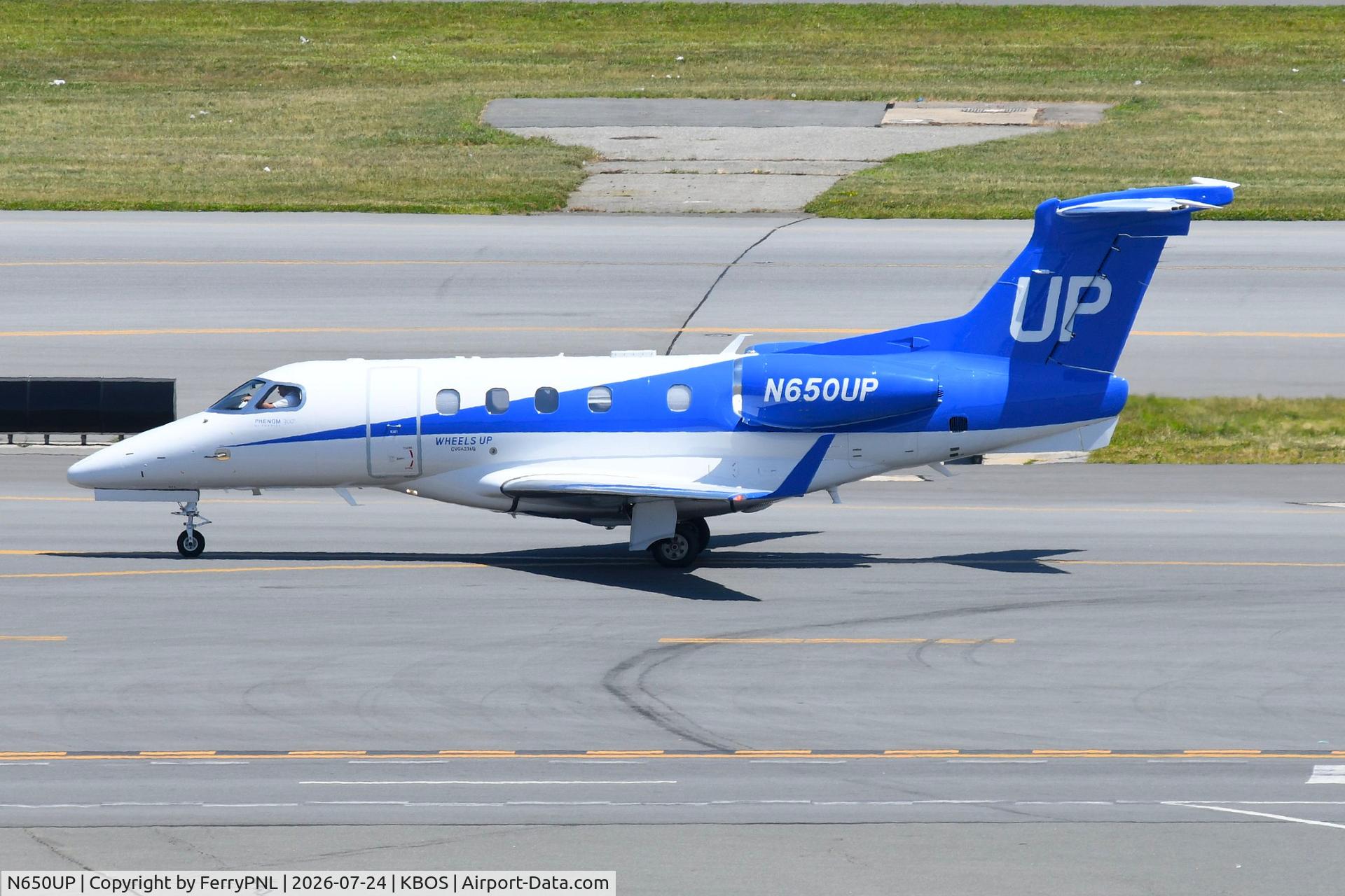 Aircraft N650UP, 2015 Embraer EMB-505 Phenom 300, c/n 50500300, Wheels UP EMB505, at KBOS, photo by FerryPNL