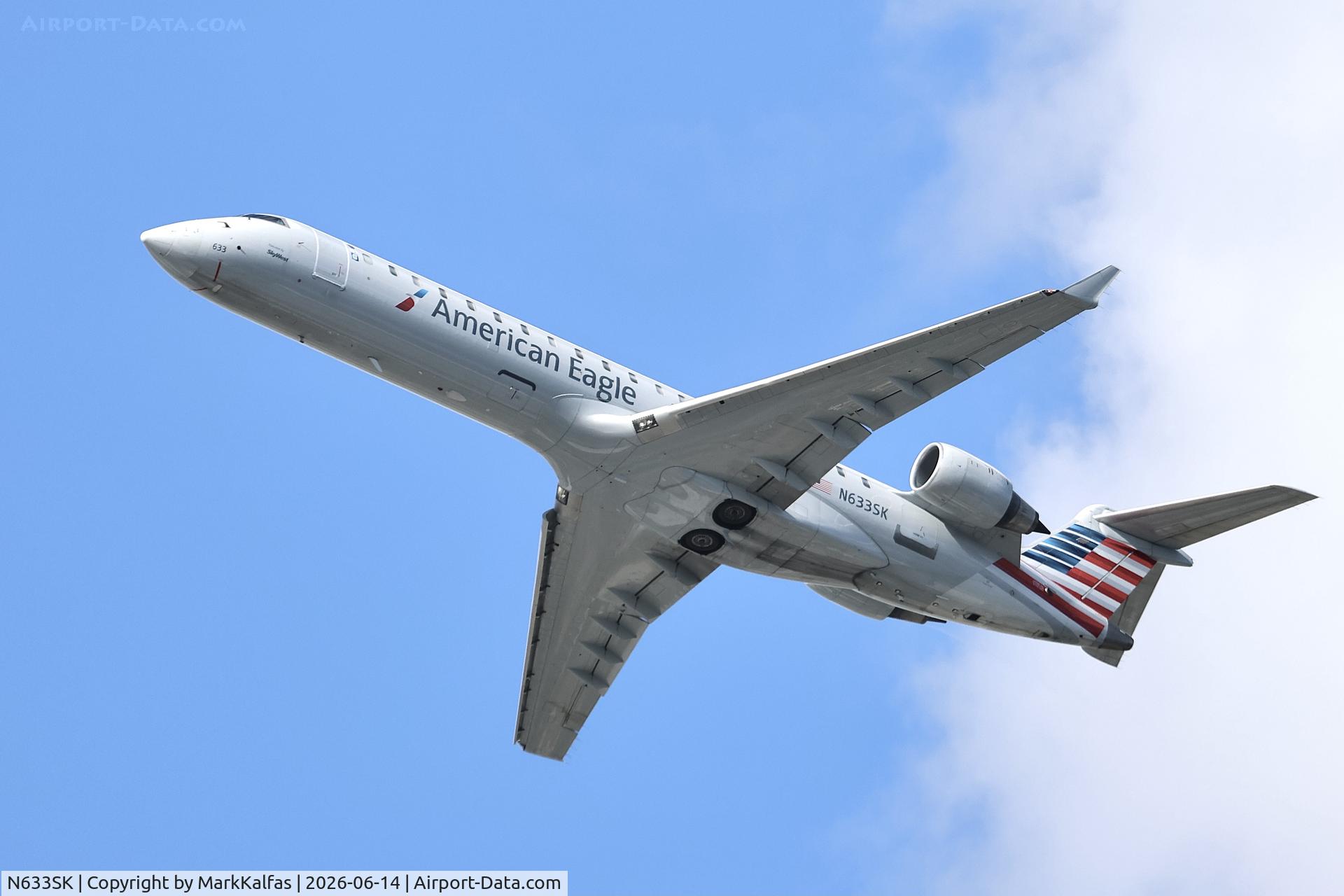 Aircraft N633SK, 2011 Canadair CL-600-2C10 Regional Jet CRJ-700, c/n 10331, CRJ7 SkyWest/American Eagle CRJ-702ER N633SK departing 28R KORD, photo by MarkKalfas