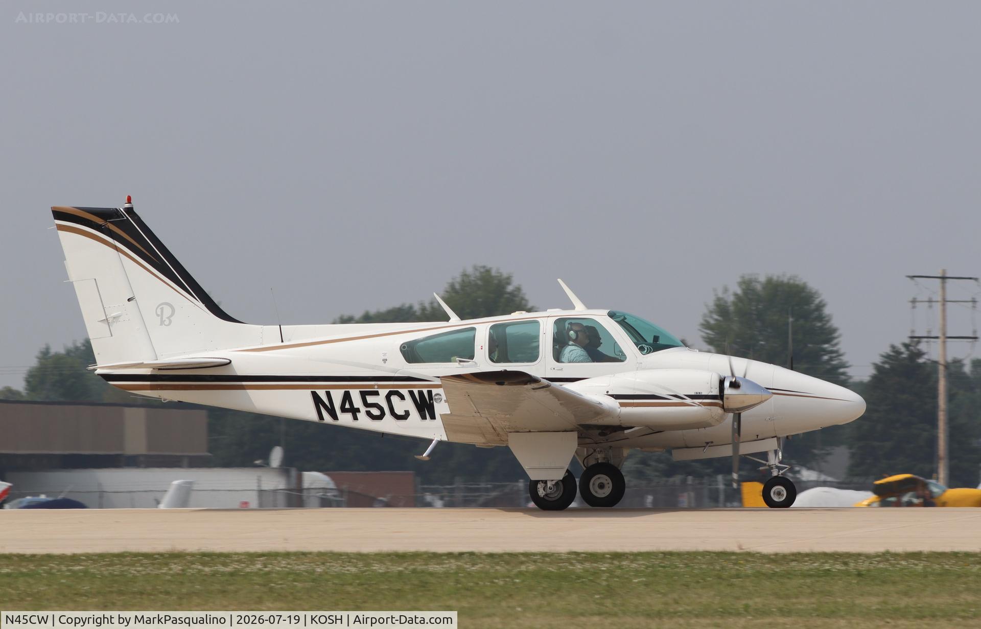 Aircraft N45CW, 1970 Beech 95-B55 (T42A) Baron, c/n TC-1319, Beech B55, at KOSH, photo by MarkPasqualino