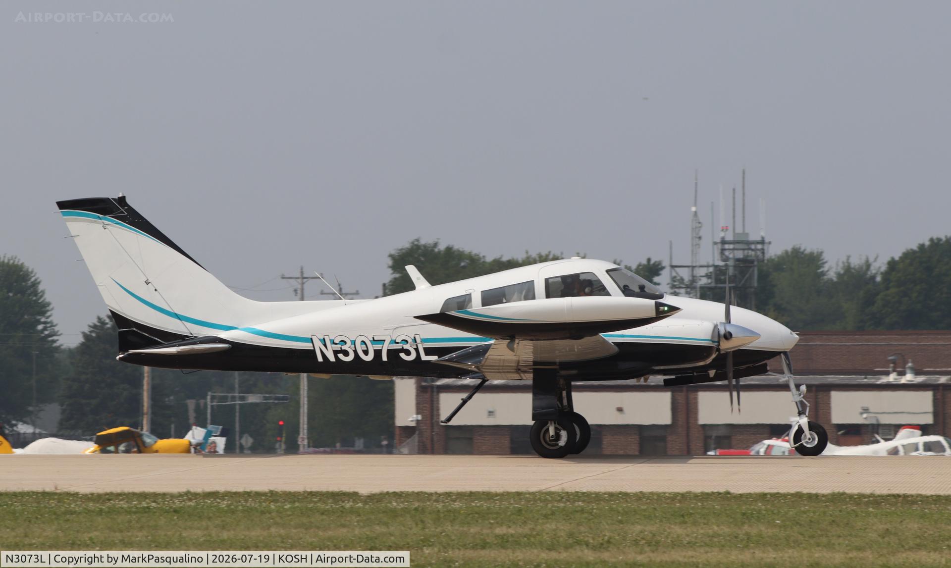 Aircraft N3073L, 1965 Cessna 310J, c/n 310J0073, Cessna 310J, at KOSH, photo by MarkPasqualino