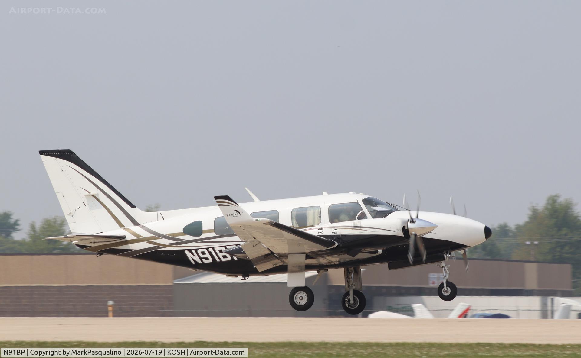 Aircraft N91BP, 1977 Piper PA-31-325 Navajo C/R, c/n 31-7812034, Piper PA-31-325, at KOSH, photo by MarkPasqualino