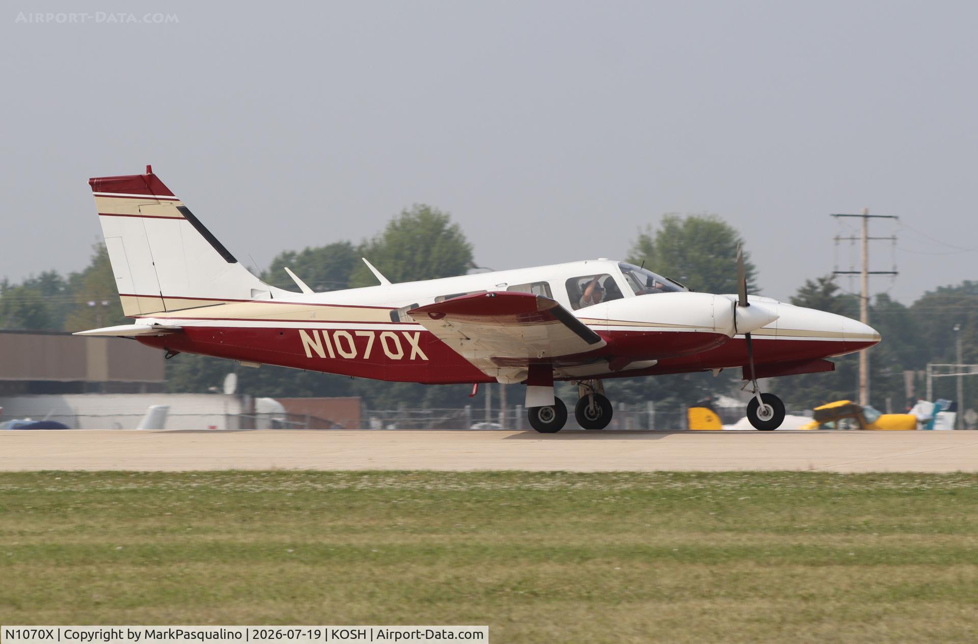 Aircraft N1070X, 1975 Piper PA-34-200T, c/n 34-7570199, Piper PA-34-200T, at KOSH, photo by MarkPasqualino