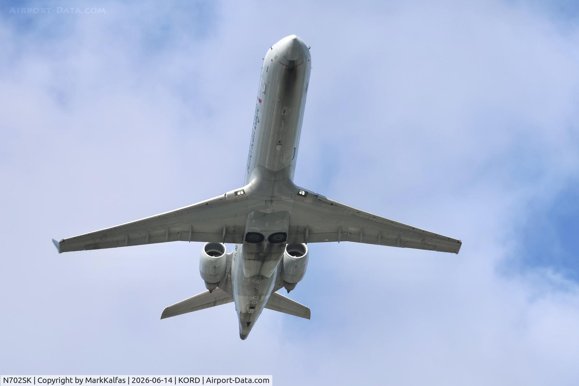 Aircraft N702SK, 2004 Bombardier CRJ-701ER (CL-600-2C10) Regional Jet, c/n 10136, CRJ7 SkyWest / American Eagle Bombardier CRJ-701LR N702SK departing 28R KORD, at KORD, photo by MarkKalfas