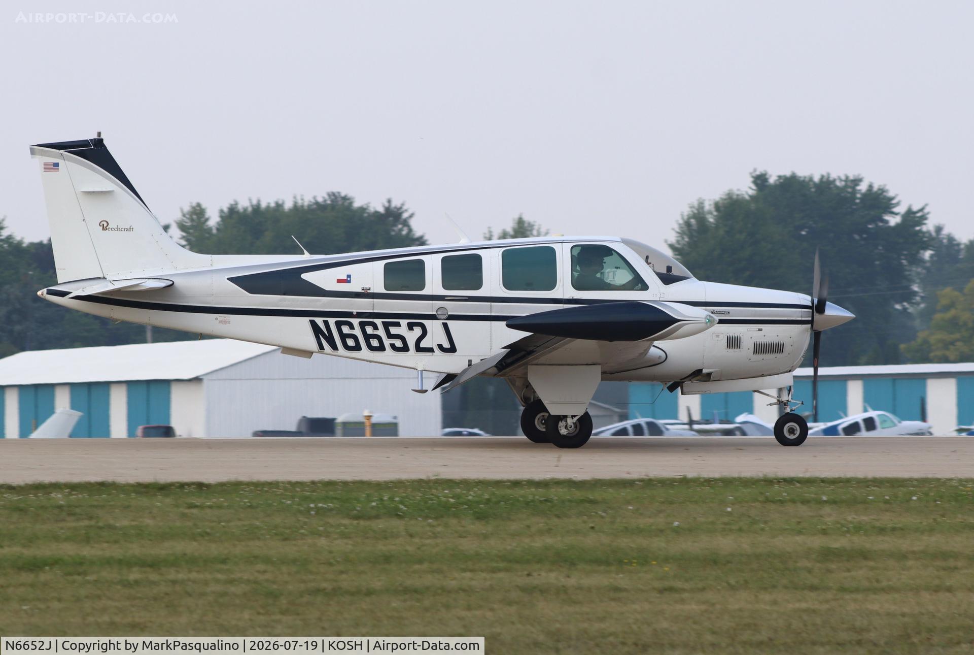 Aircraft N6652J, 1979 Beech A36TC Bonanza 36, c/n EA-11, Beech A36TC, at KOSH, photo by MarkPasqualino