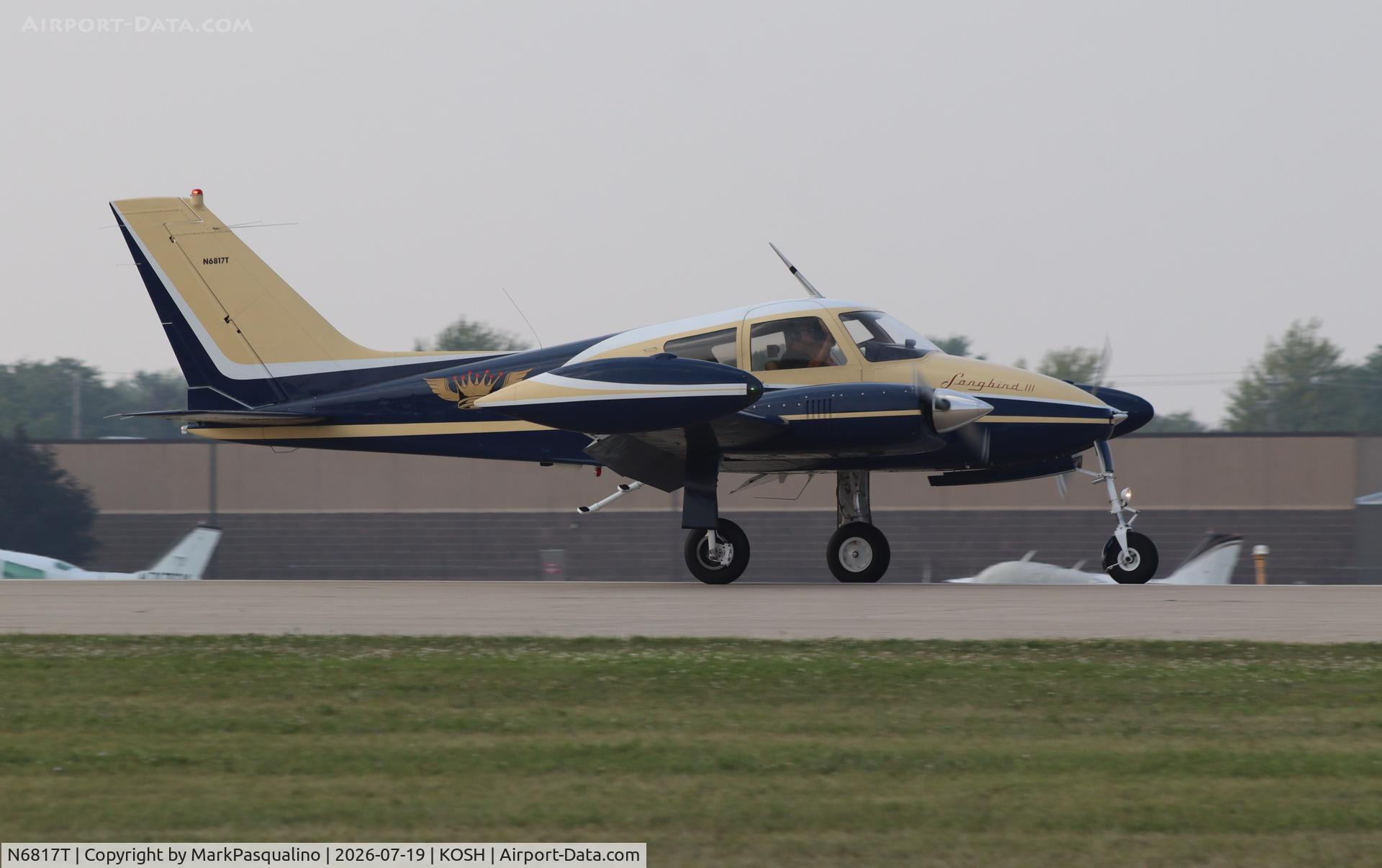 Aircraft N6817T, 1960 Cessna 310D, c/n 39117, Cessna 310D, at KOSH, photo by MarkPasqualino