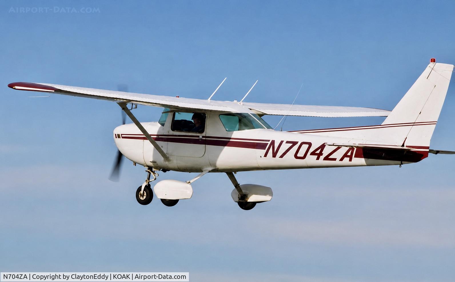 Aircraft N704ZA, 1976 Cessna 150M, c/n 15078992, Lou Fields Cessna Oakland airport early 1990's, at KOAK, photo by ClaytonEddy