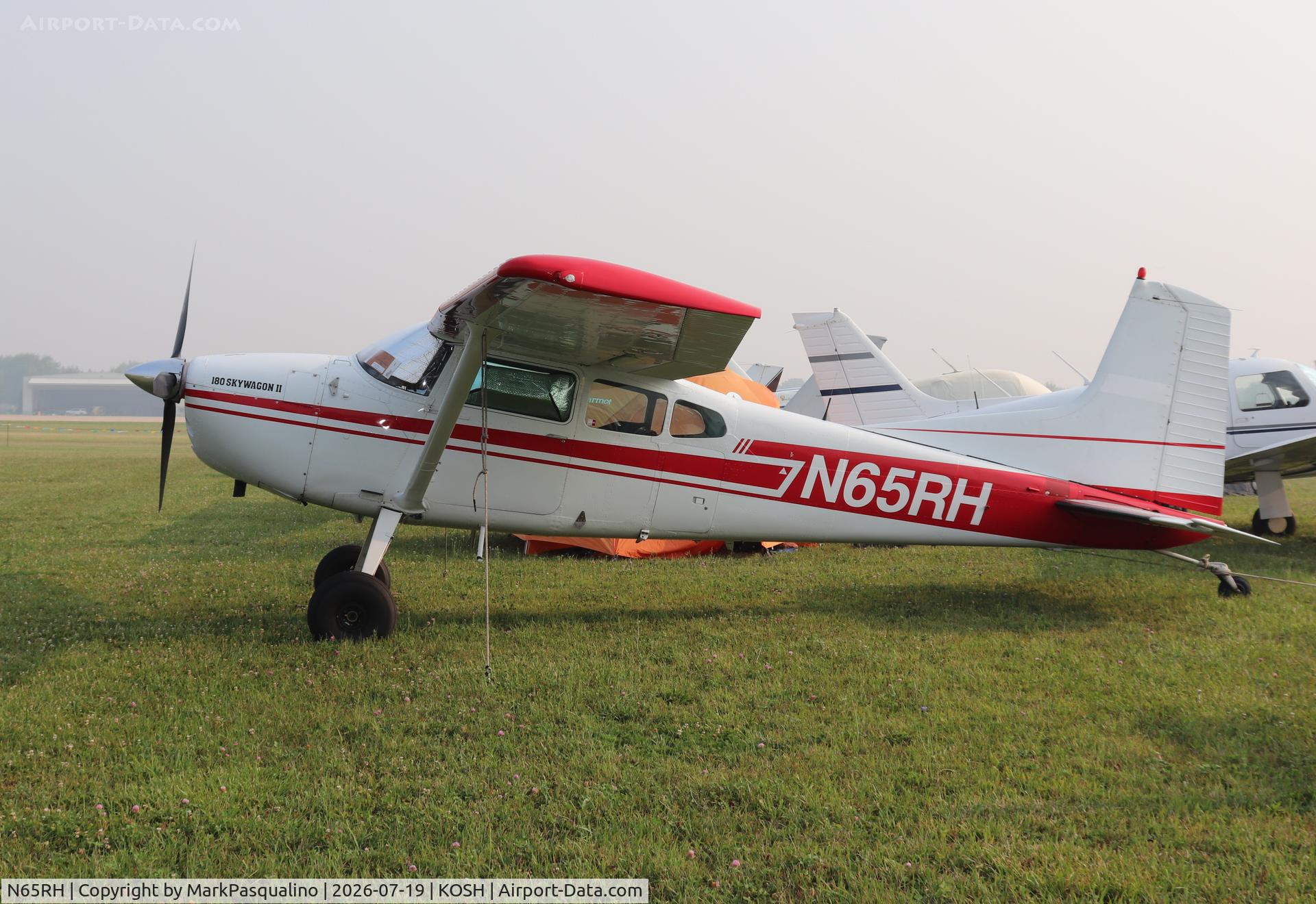 Aircraft N65RH, 1977 Cessna 180K Skywagon, c/n 18052869, Cessna 180K, at KOSH, photo by MarkPasqualino