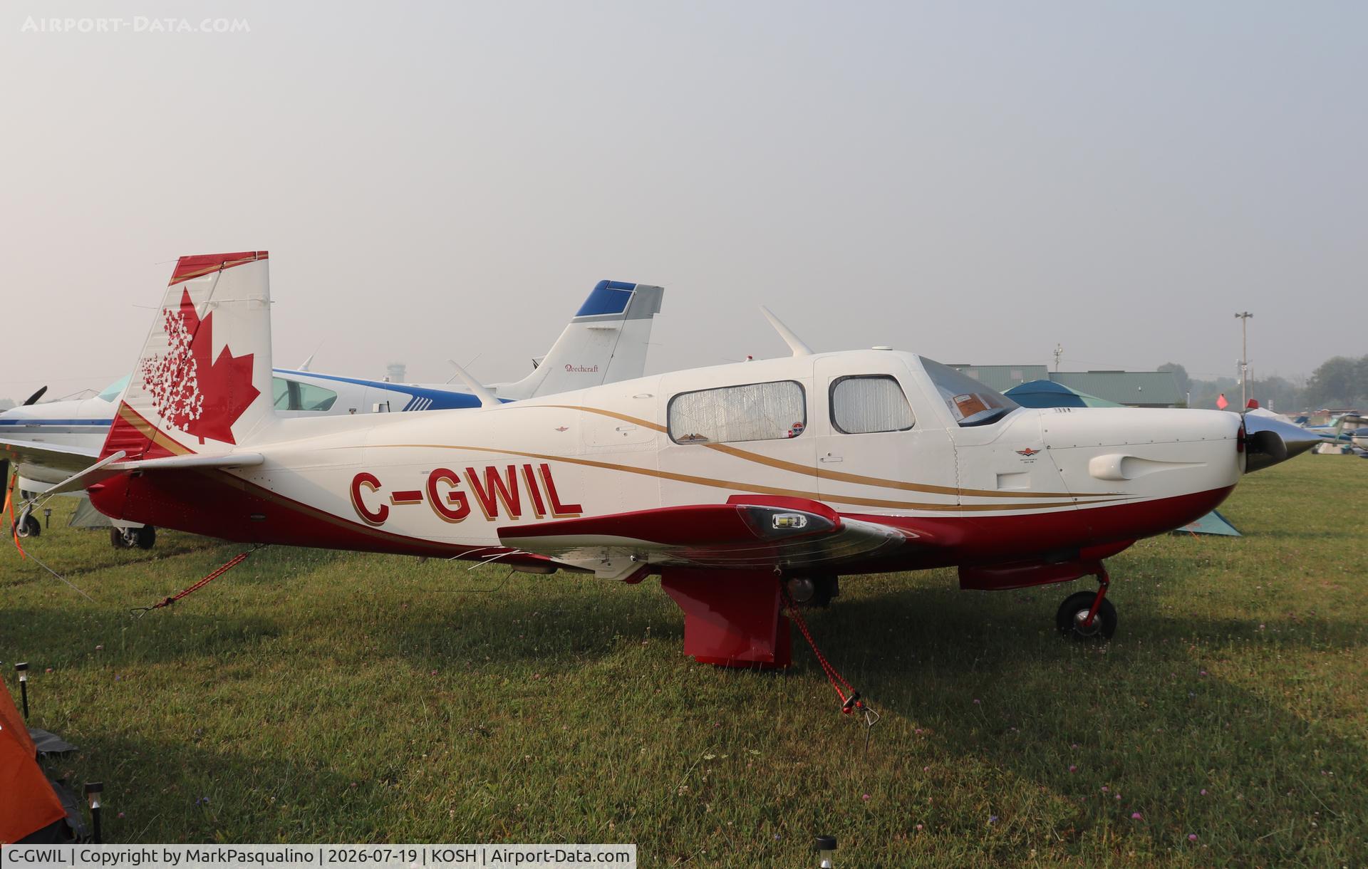 Aircraft C-GWIL, 1981 Mooney M20K, c/n 25-0592, Mooney M20K, at KOSH, photo by MarkPasqualino