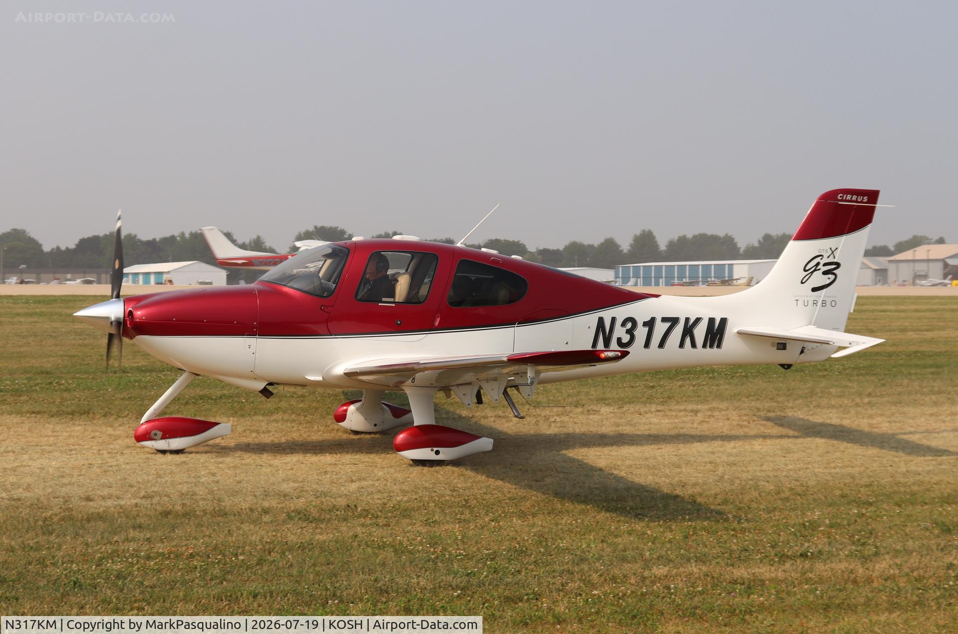 Aircraft N317KM, 2008 Cirrus SR22, c/n 2942, Cirrus SR22, at KOSH, photo by MarkPasqualino