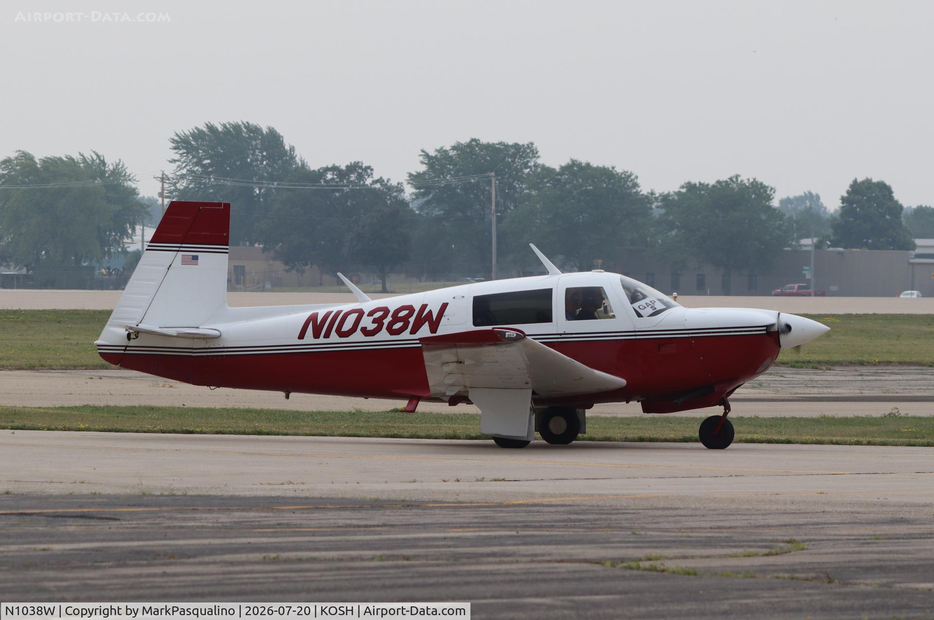 Aircraft N1038W, 1981 Mooney M20J 201, c/n 24-1118, Mooney M20J, at KOSH, photo by MarkPasqualino