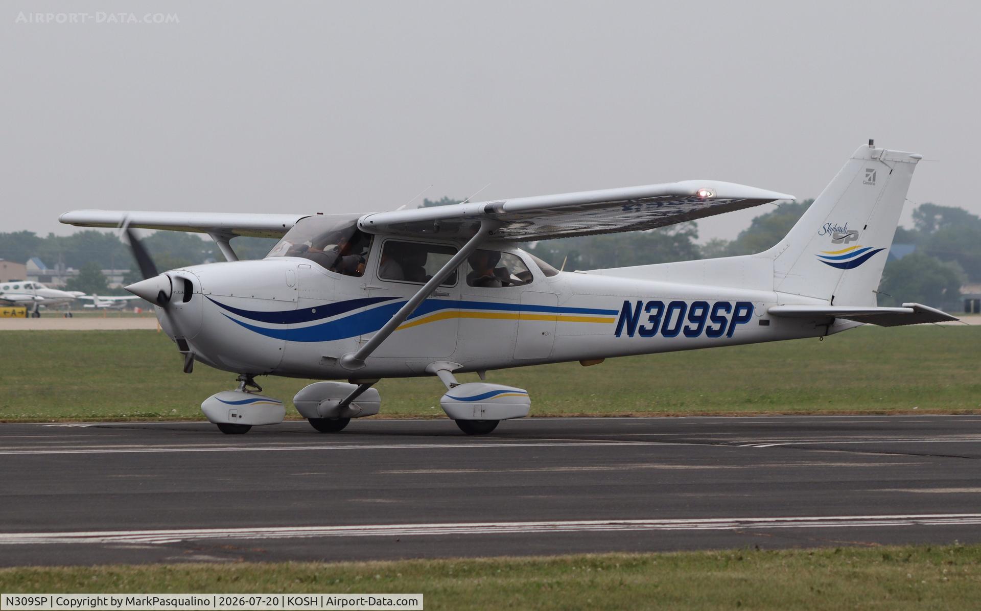 Aircraft N309SP, 1999 Cessna 172S, c/n 172S8245, Cessna 172S, at KOSH, photo by MarkPasqualino