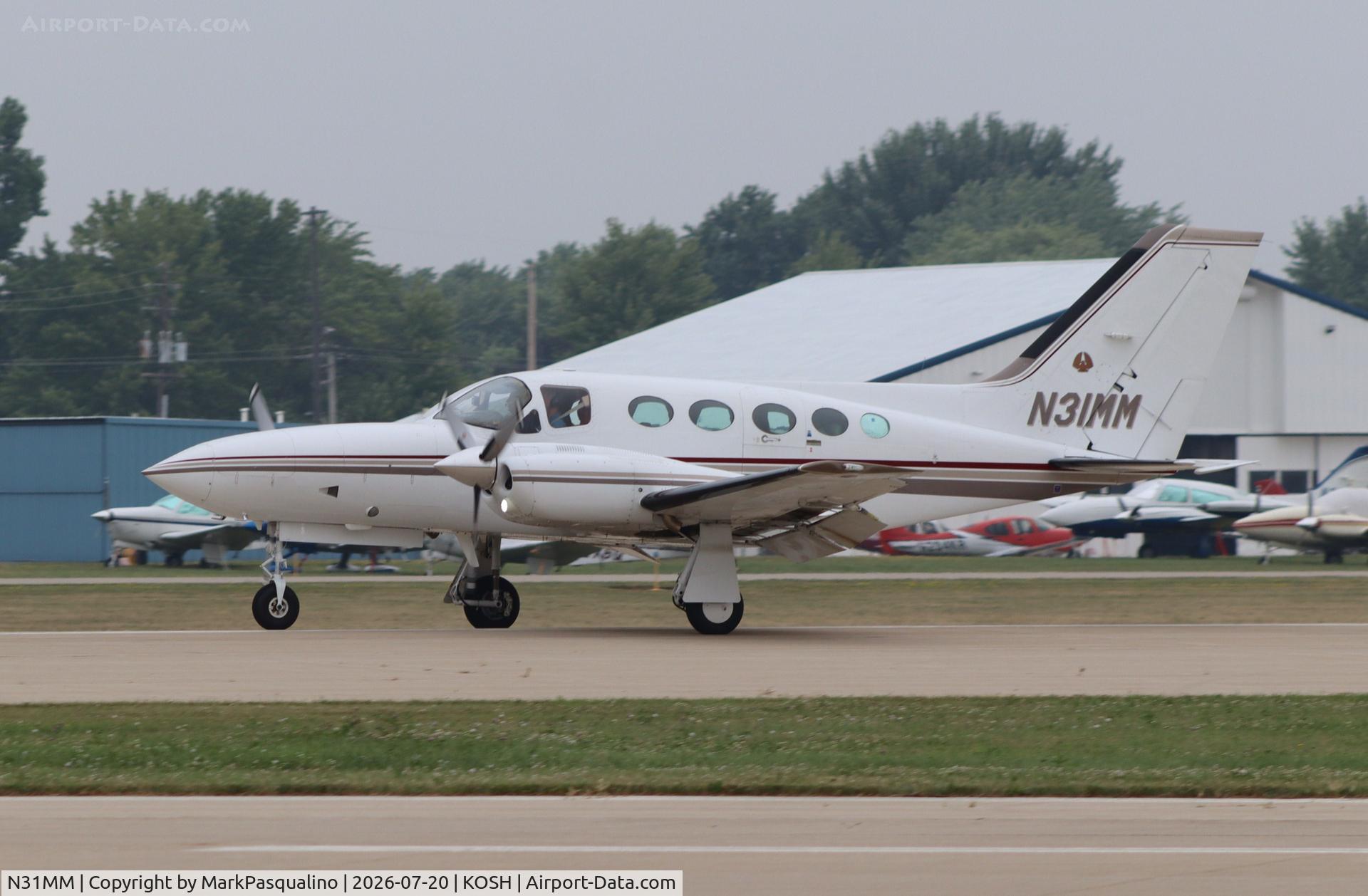 Aircraft N31MM, Cessna 421C Golden Eagle, c/n 421C0819, Cessna 421C, at KOSH, photo by MarkPasqualino