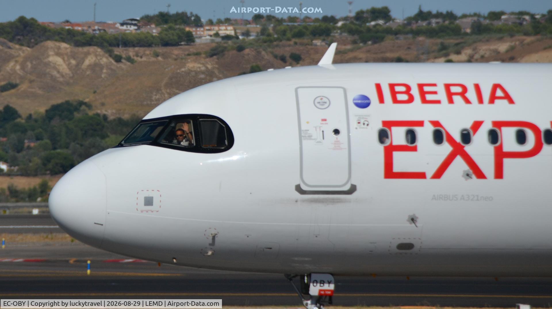 Aircraft EC-OBY, 2023 Airbus A321-271NX, c/n 11454, Iberia Express A321neo pilot waving, at LEMD, photo by luckytravel