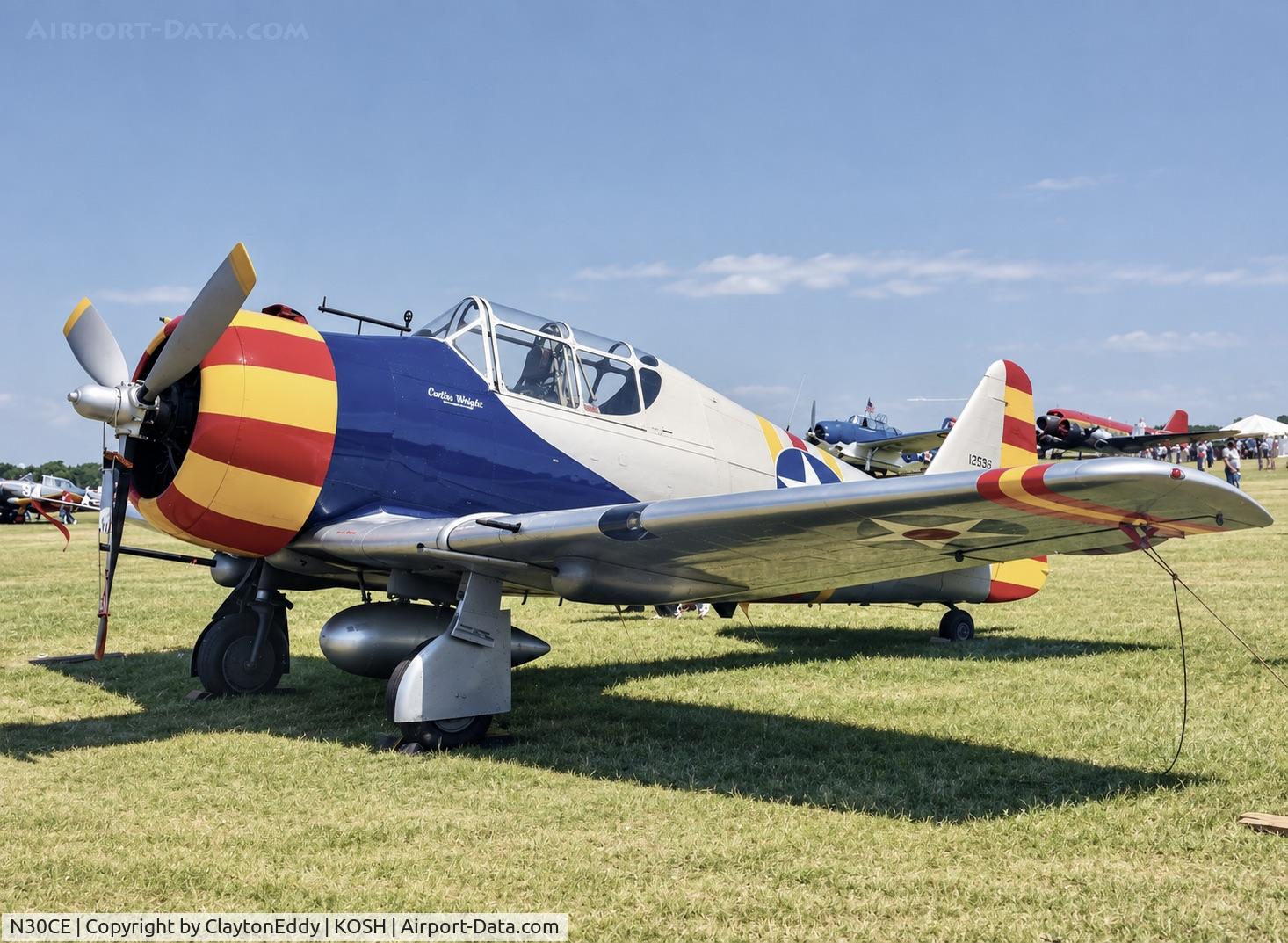 Aircraft N30CE, North American AT-6, c/n 8812956, Oshkosh airshow mid 1990's, at KOSH, photo by ClaytonEddy