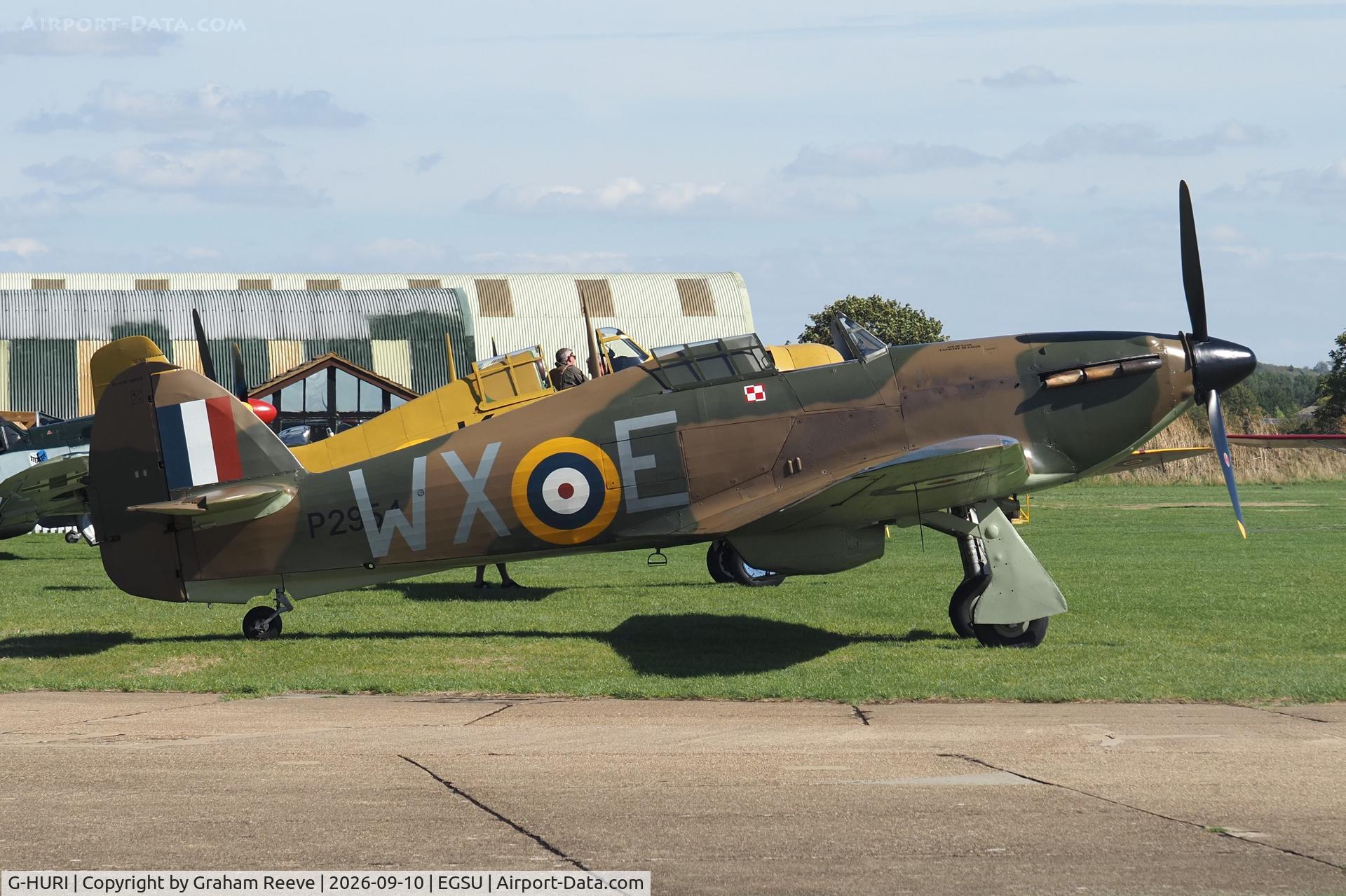Aircraft G-HURI, 1942 Hawker (CCF) Hurricane Mk12A, c/n 72036, Parked at Duxford., at EGSU, photo by Graham Reeve