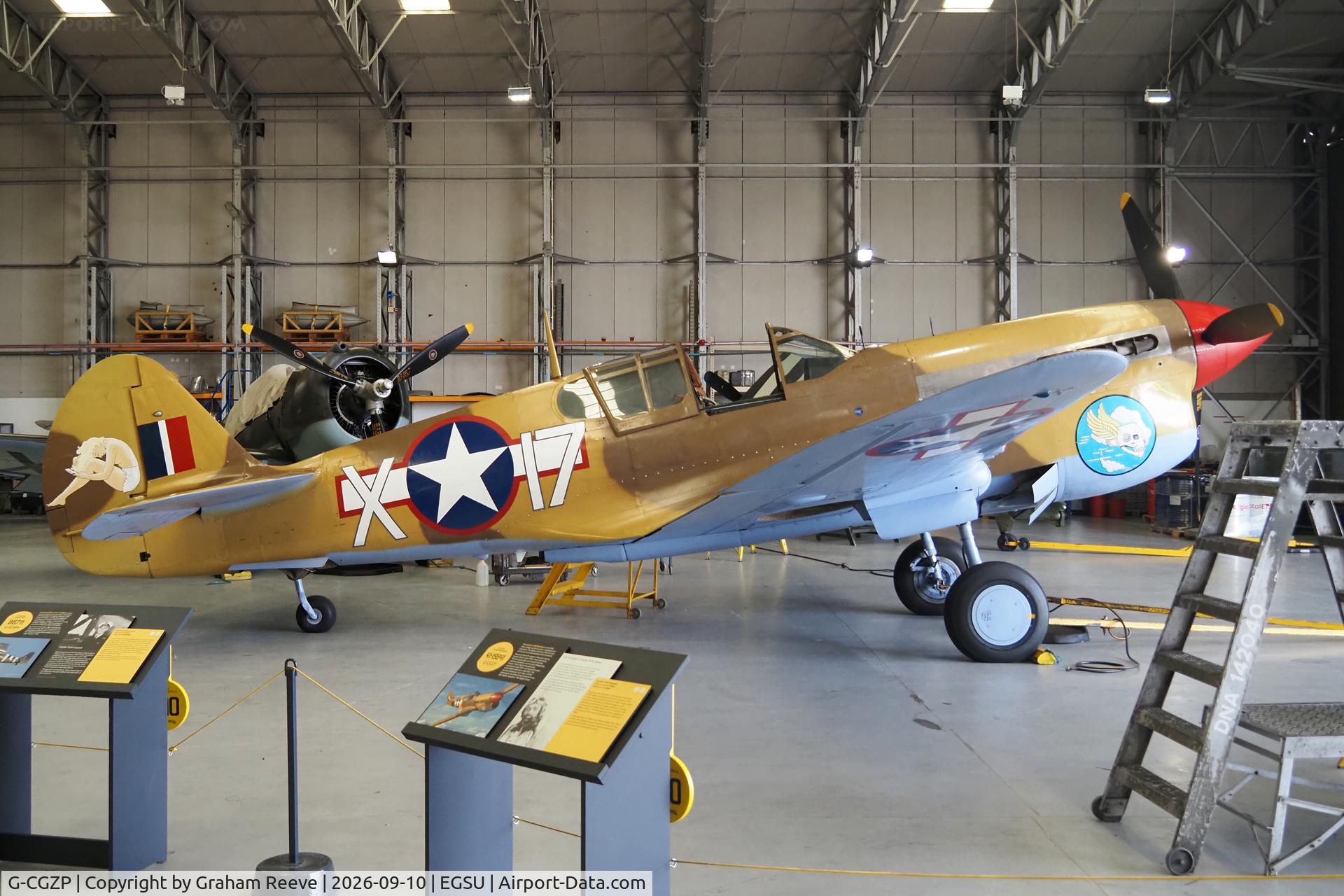 Aircraft G-CGZP, 1942 Curtiss P-40F Warhawk, c/n 19503, On display at the IWM, Duxford., at EGSU, photo by Graham Reeve