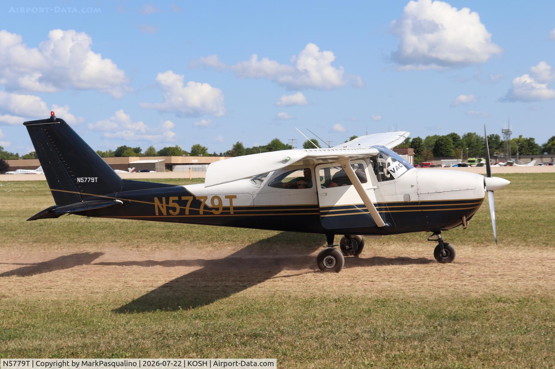 Aircraft N5779T, 1964 Cessna 172E, c/n 17251679, Cessna 172E, at KOSH, photo by MarkPasqualino