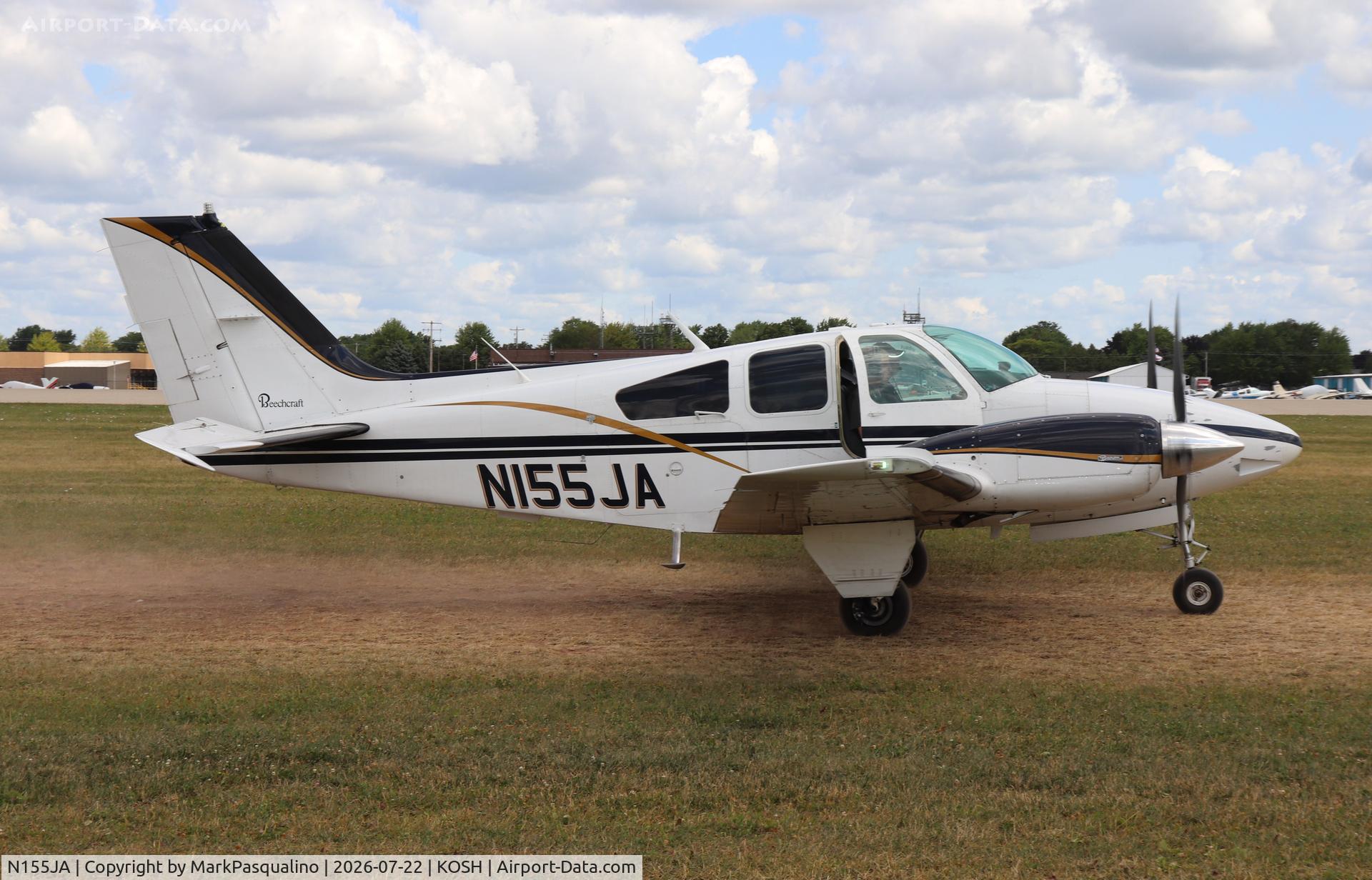 Aircraft N155JA, 1976 Beech 95-B55 (T42A) Baron, c/n TC-1993, Beech B55, at KOSH, photo by MarkPasqualino