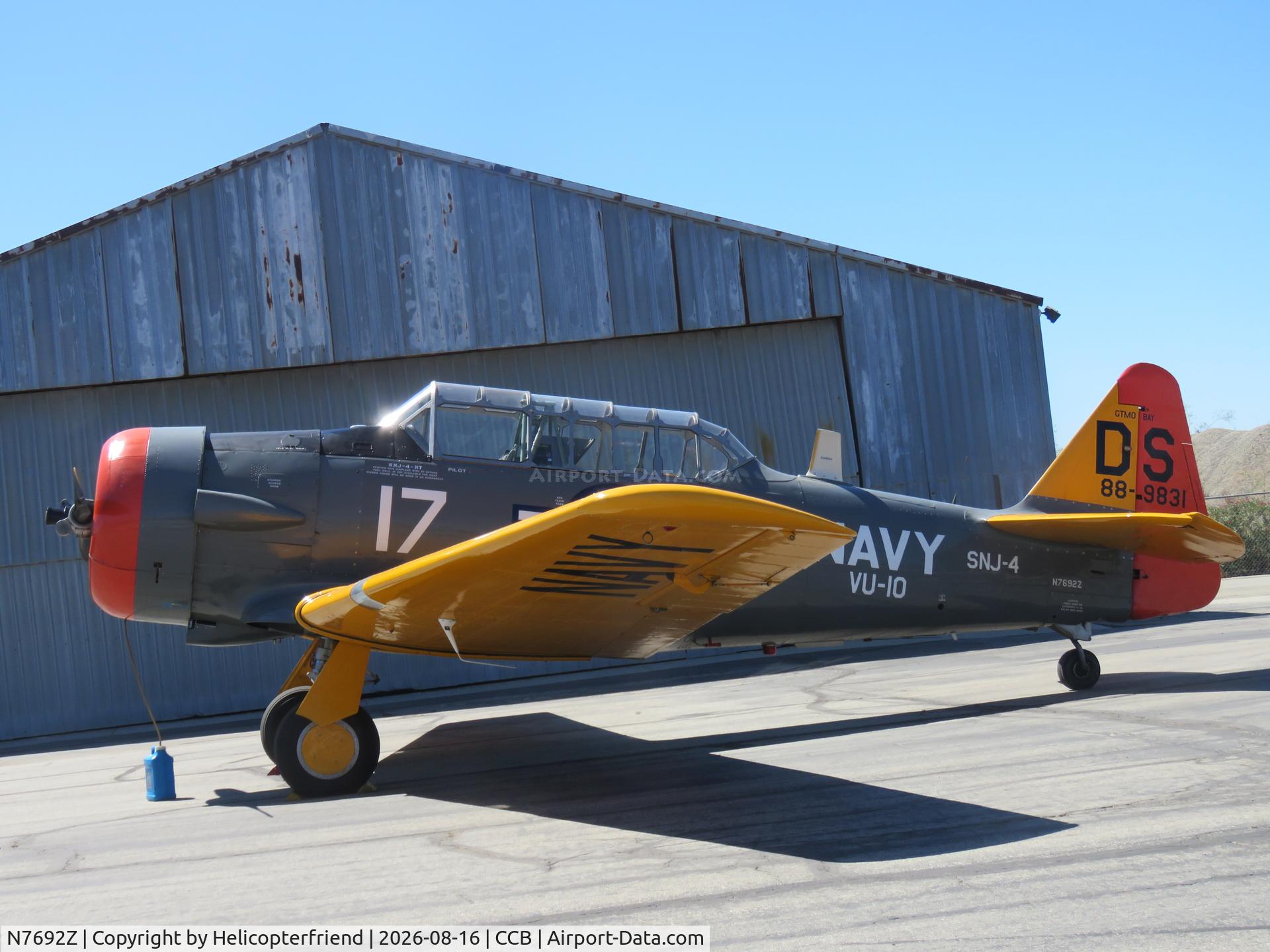 Aircraft N7692Z, 1942 North American SNJ-4 Texan, c/n 88-9831, Parked by a hanger, at CCB, photo by Helicopterfriend