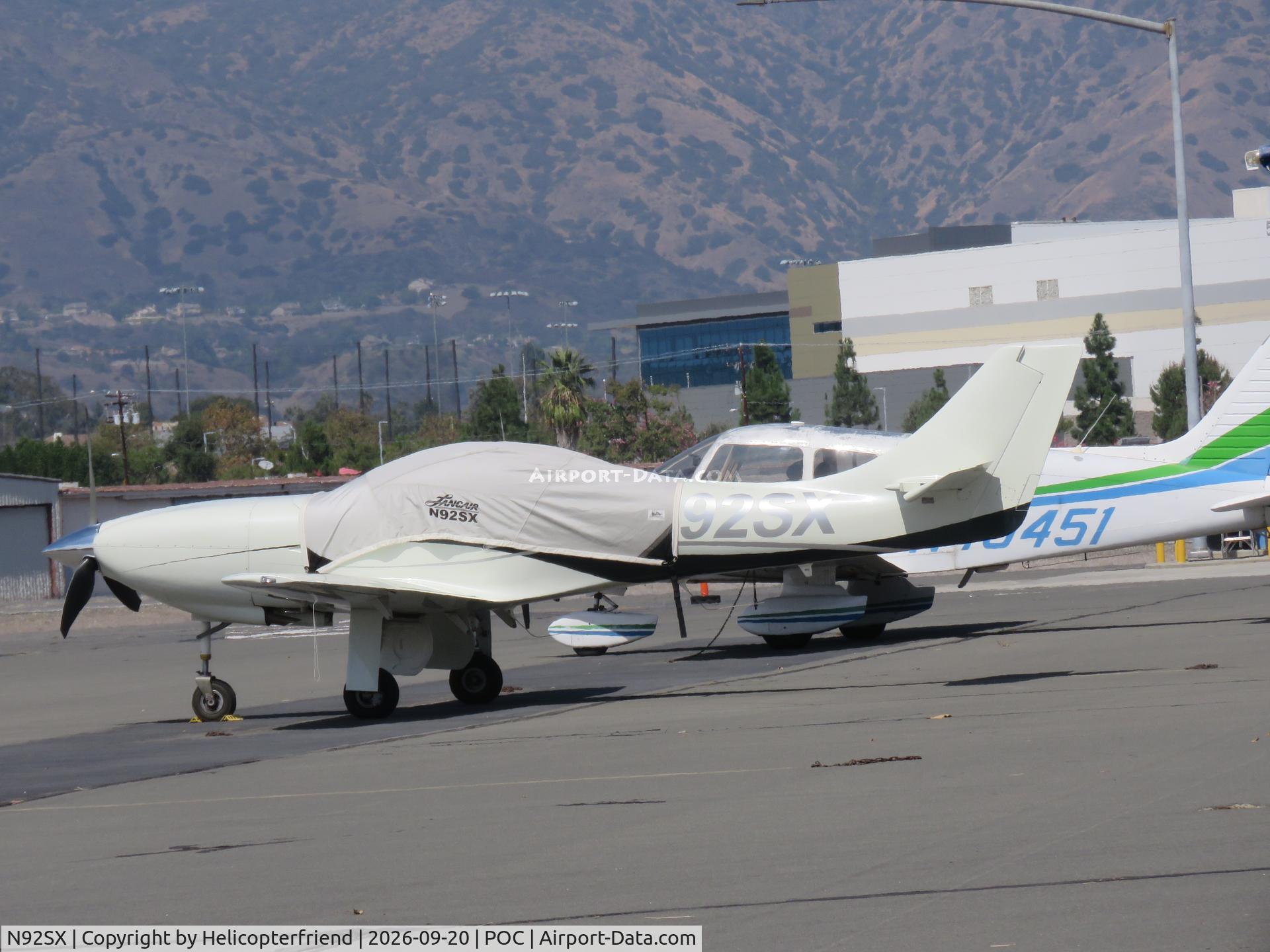 Aircraft N92SX, 2006 Lancair Legacy, c/n L2K-254, Covered and parked in transit parking, at POC, photo by Helicopterfriend