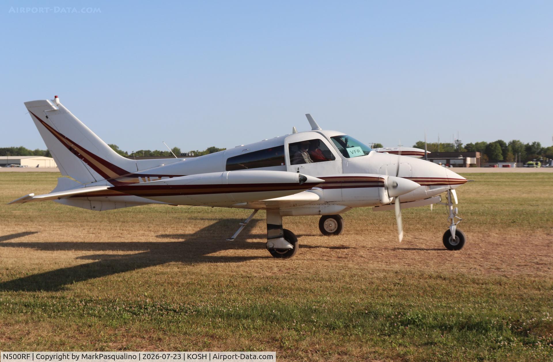 Aircraft N500RF, 1968 Cessna 310P, c/n 310P0026, Cessna 310P, at KOSH, photo by MarkPasqualino