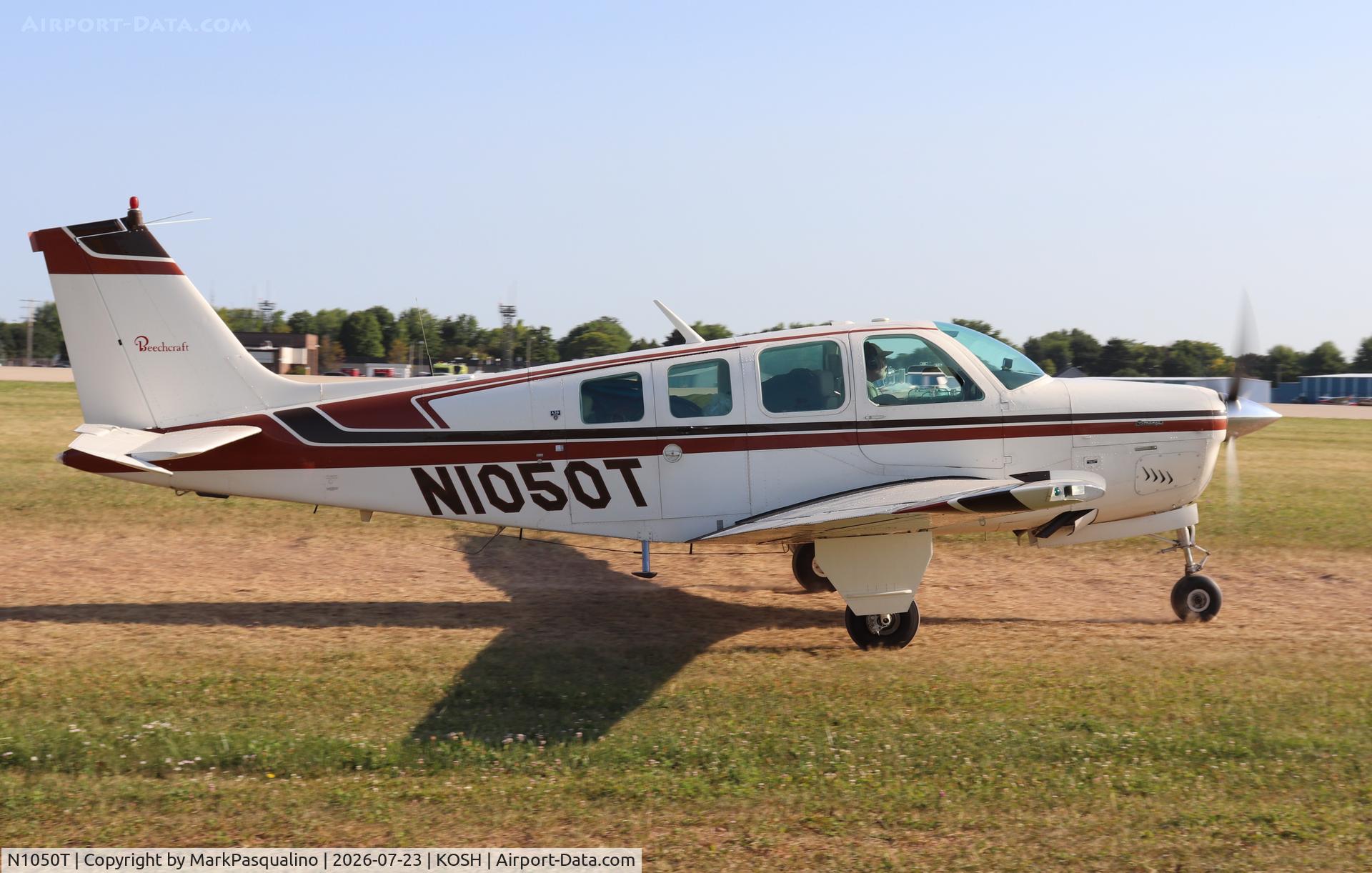 Aircraft N1050T, 1976 Beech A36 Bonanza 36, c/n E-881, Beech A36, at KOSH, photo by MarkPasqualino