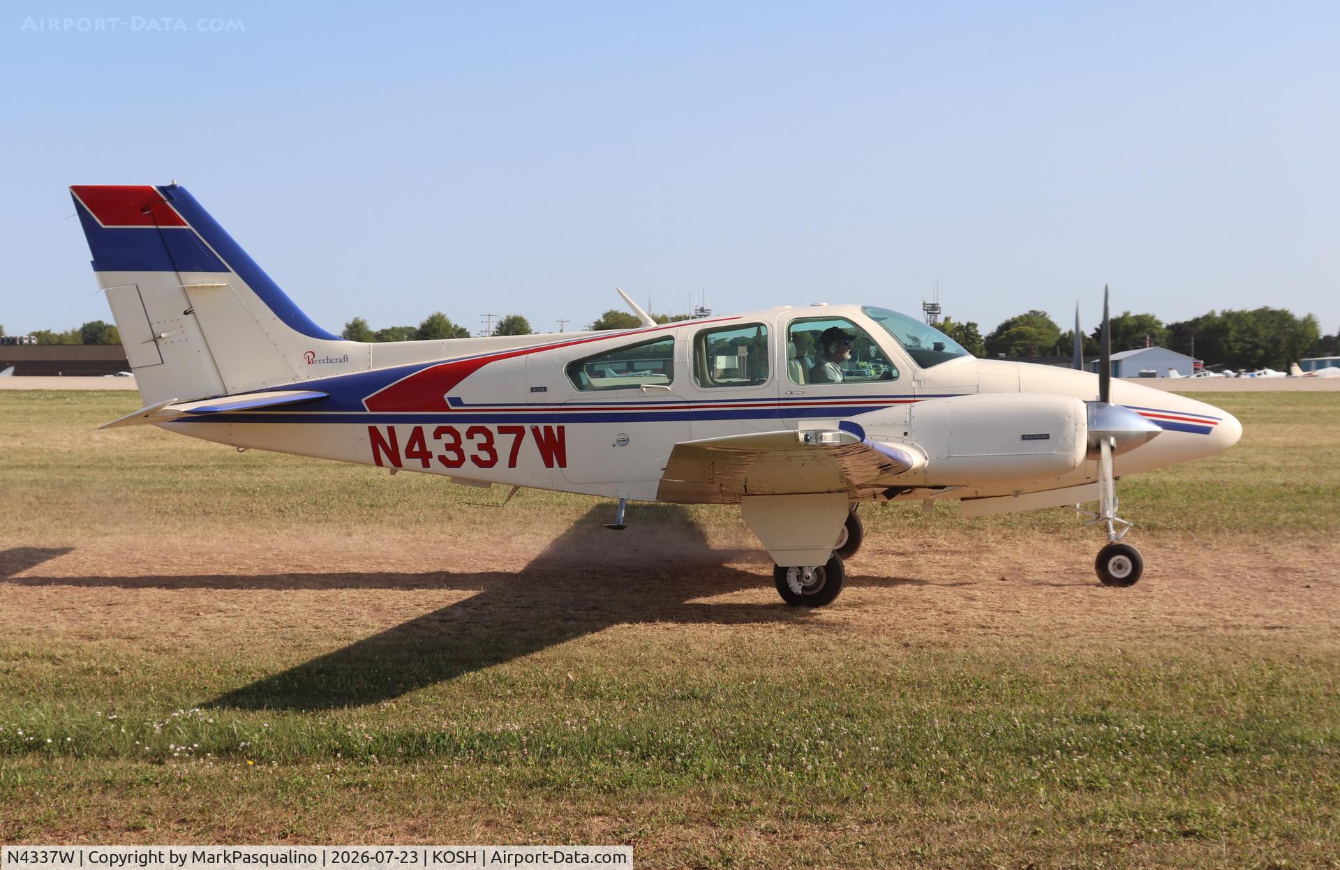 Aircraft N4337W, 1974 Beech 95-B55 Baron, c/n TC-1665, Beech B55, at KOSH, photo by MarkPasqualino