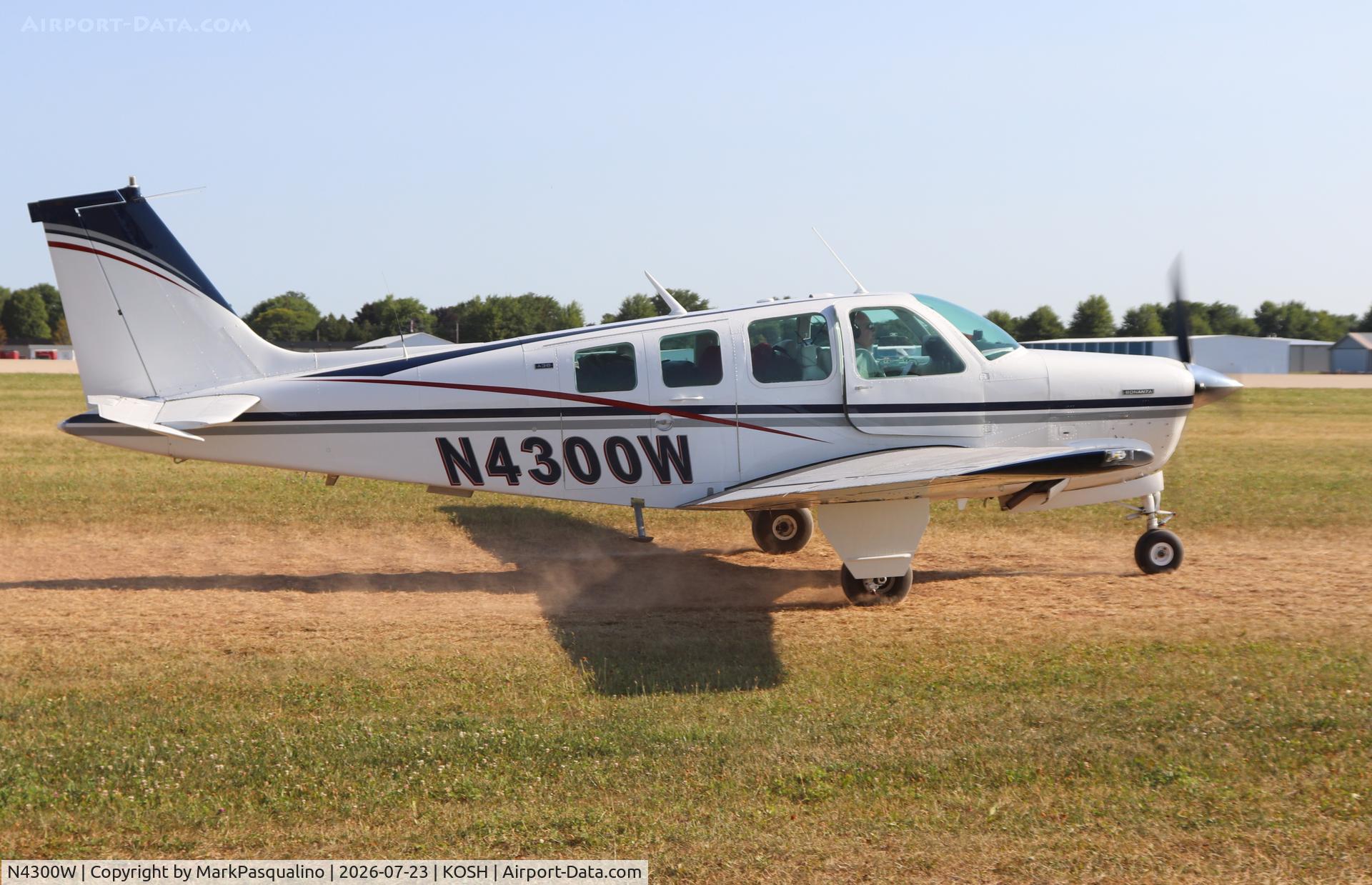Aircraft N4300W, 1969 Cessna 182M Skylane, c/n 18260049, Beech A36, at KOSH, photo by MarkPasqualino