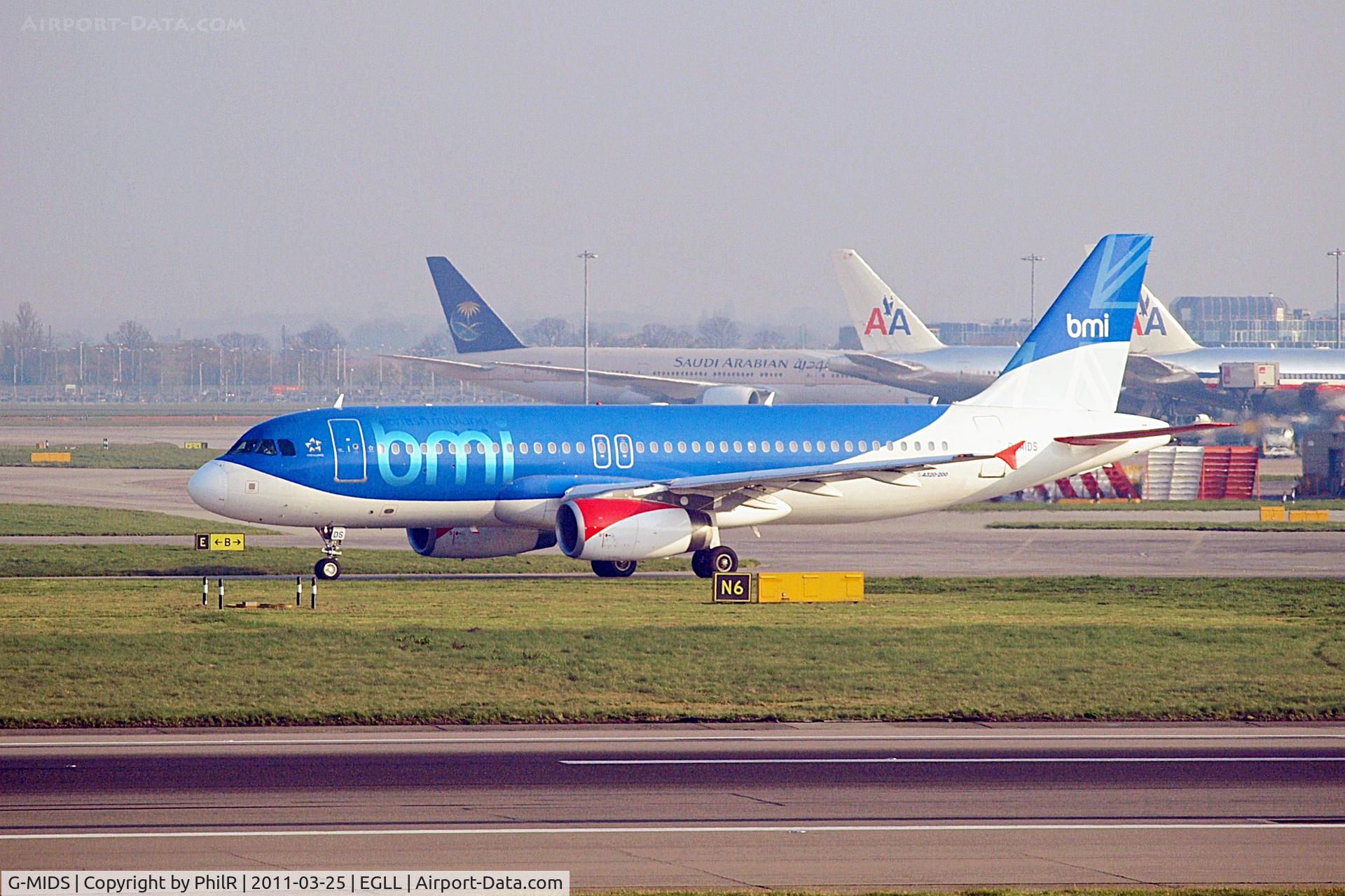 Aircraft G-MIDS, 2001 Airbus A320-232, c/n 1424, G-MIDS 2001 A320-200 BMI LHR 25.03.11.JPG, at EGLL, photo by PhilR