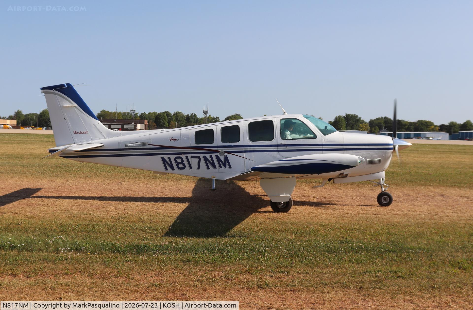 Aircraft N817NM, 1979 Beech A36TC Bonanza 36, c/n EA-27, Beech A36TC, at KOSH, photo by MarkPasqualino