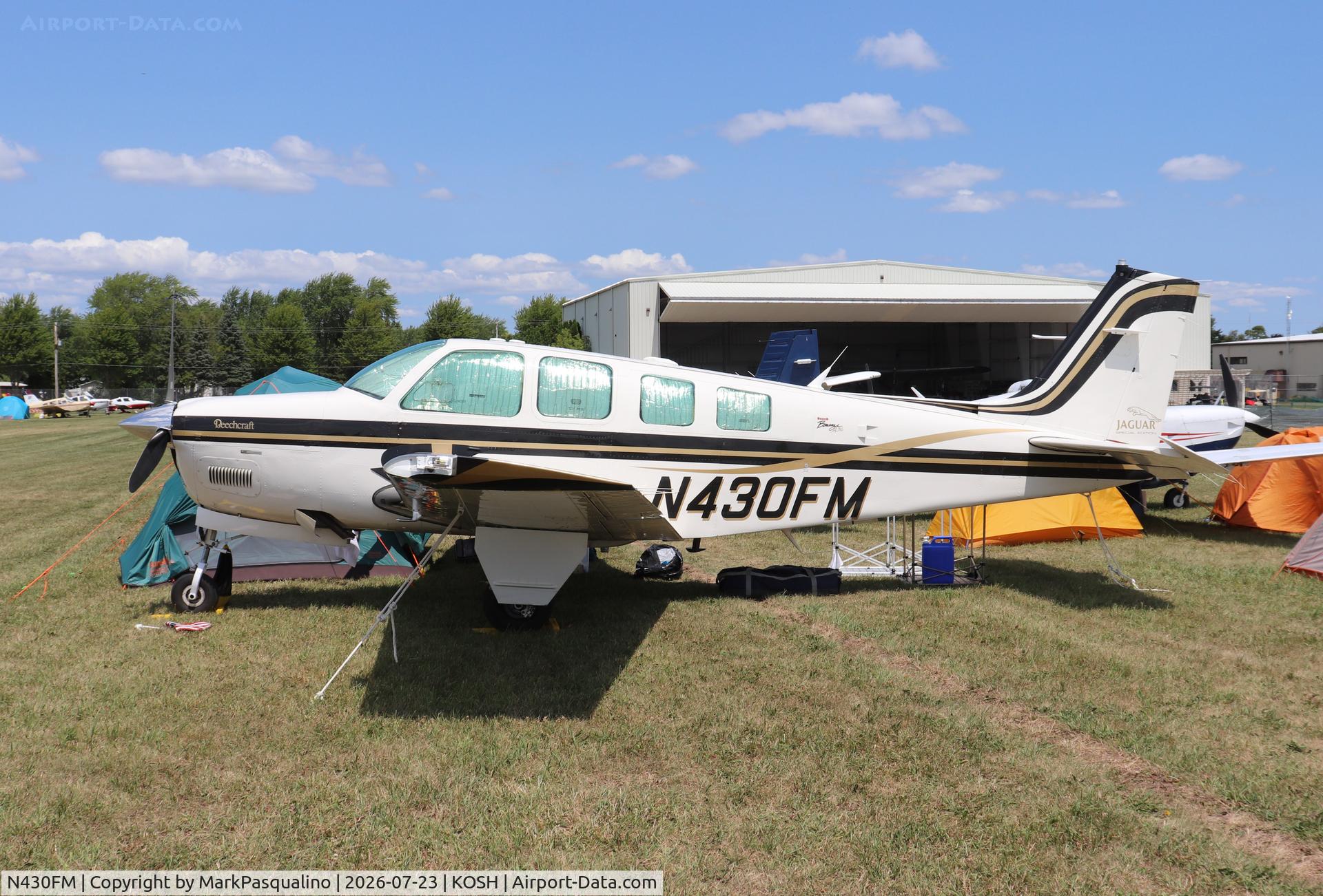 Aircraft N430FM, 2000 Raytheon Aircraft Company A36 Bonanza, c/n E-3319, Beech A36, at KOSH, photo by MarkPasqualino