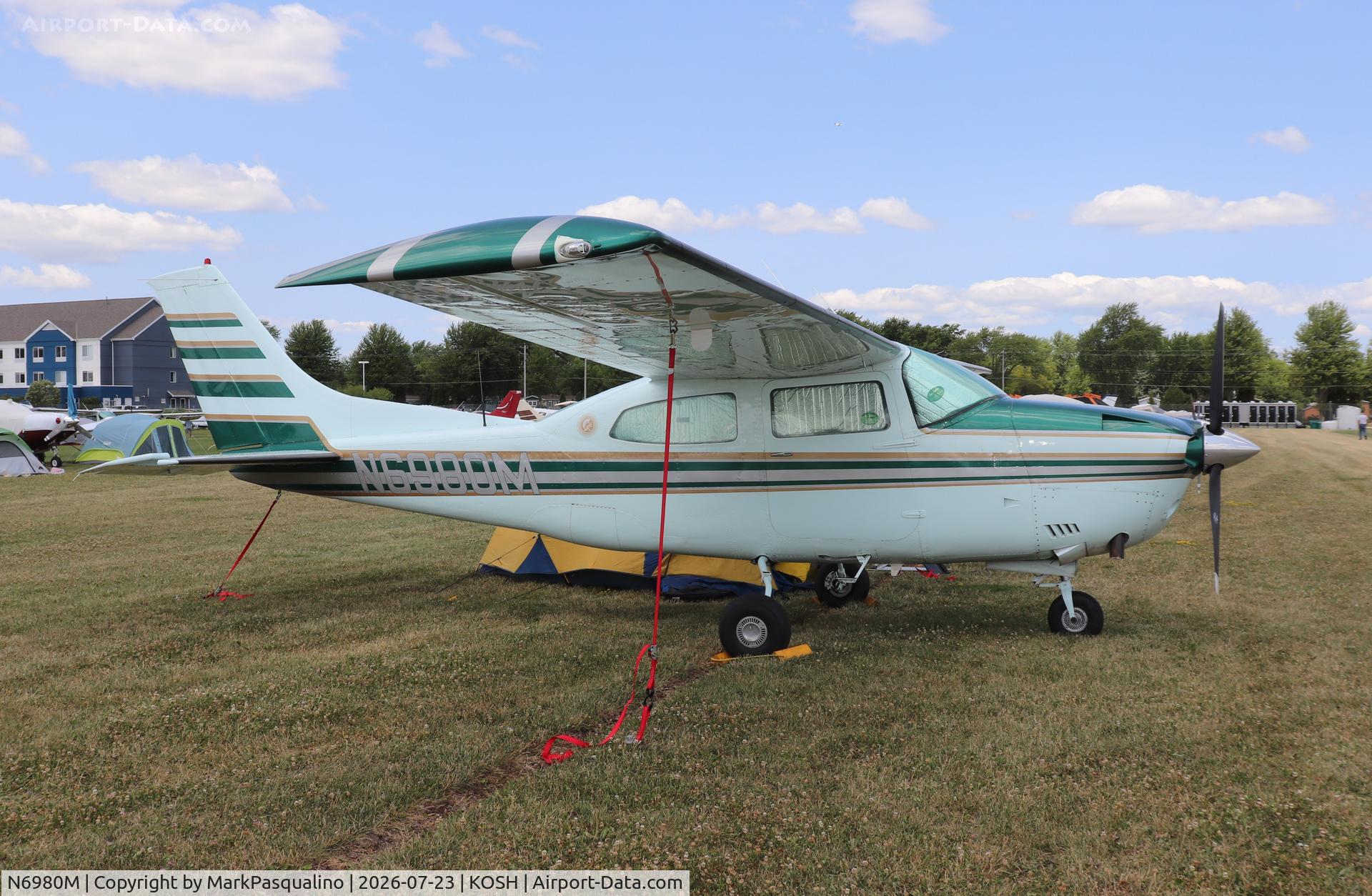 Aircraft N6980M, 1977 Cessna T210M Turbo Centurion, c/n 21062005, Cessna T210M, at KOSH, photo by MarkPasqualino