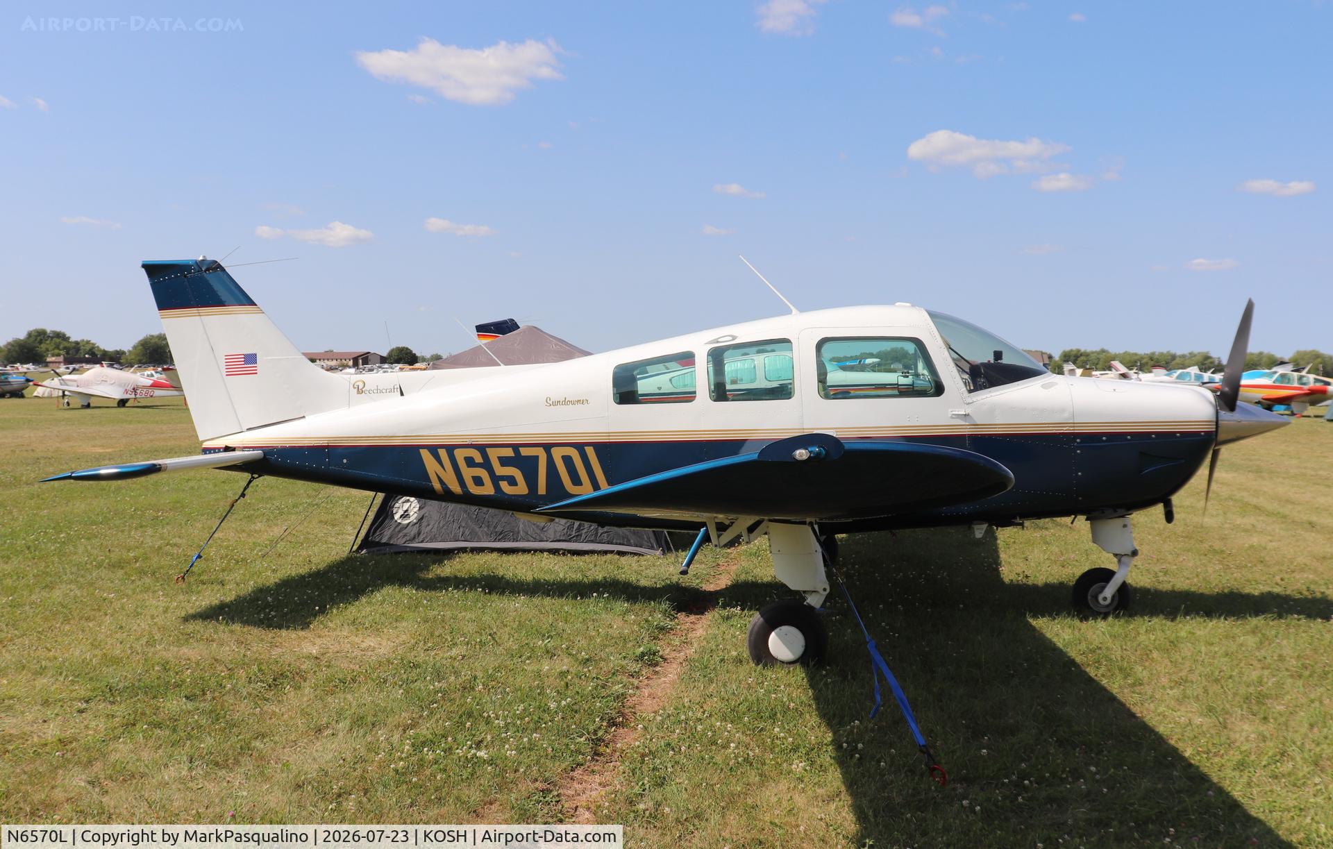 Aircraft N6570L, 1983 Beech C23 Sundowner 180, c/n M-2379, Beech C23, at KOSH, photo by MarkPasqualino
