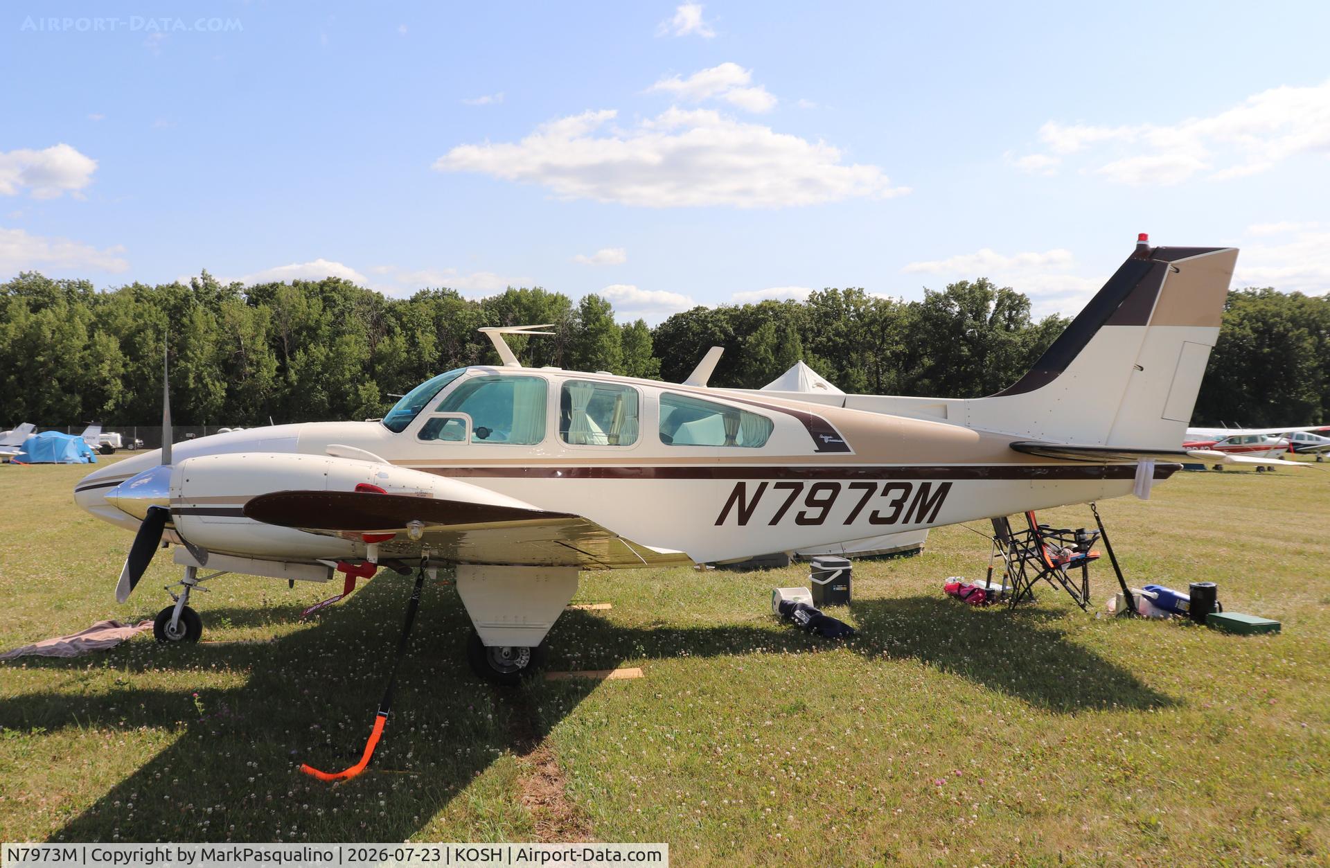 Aircraft N7973M, 1966 Beech C55 Baron (95-C55), c/n TE-208, Beech C55, at KOSH, photo by MarkPasqualino