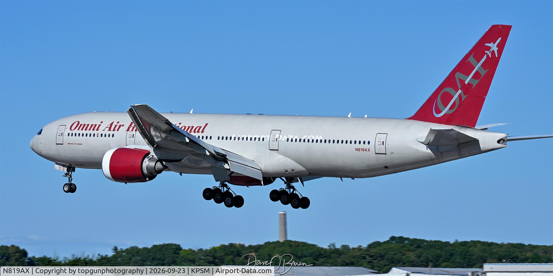 Aircraft N819AX, 2004 Boeing 777-2U8, c/n 33681, CAMBER510 over the numbers for RW34, at KPSM, photo by topgunphotography
