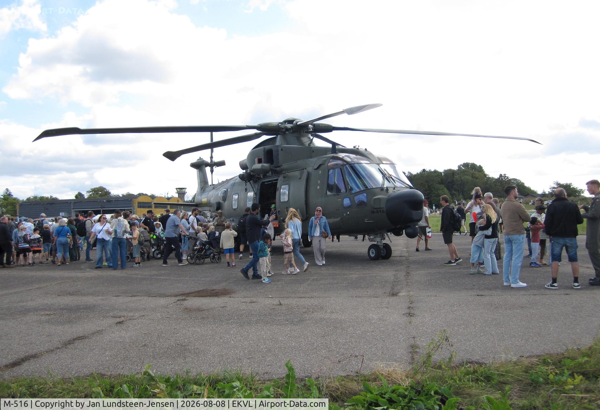Aircraft M-516, 2009 AgustaWestland EH-101 Mk.512 Merlin Joint Supporter, c/n 50223/DEN16, An airshow at the former Vaerloese Air Base in Denmark with a Royal Danish Air Force EH101 search and rescue helicopter on display. Hangar 2 and control tower in background., at EKVL, photo by Jan Lundsteen-Jensen