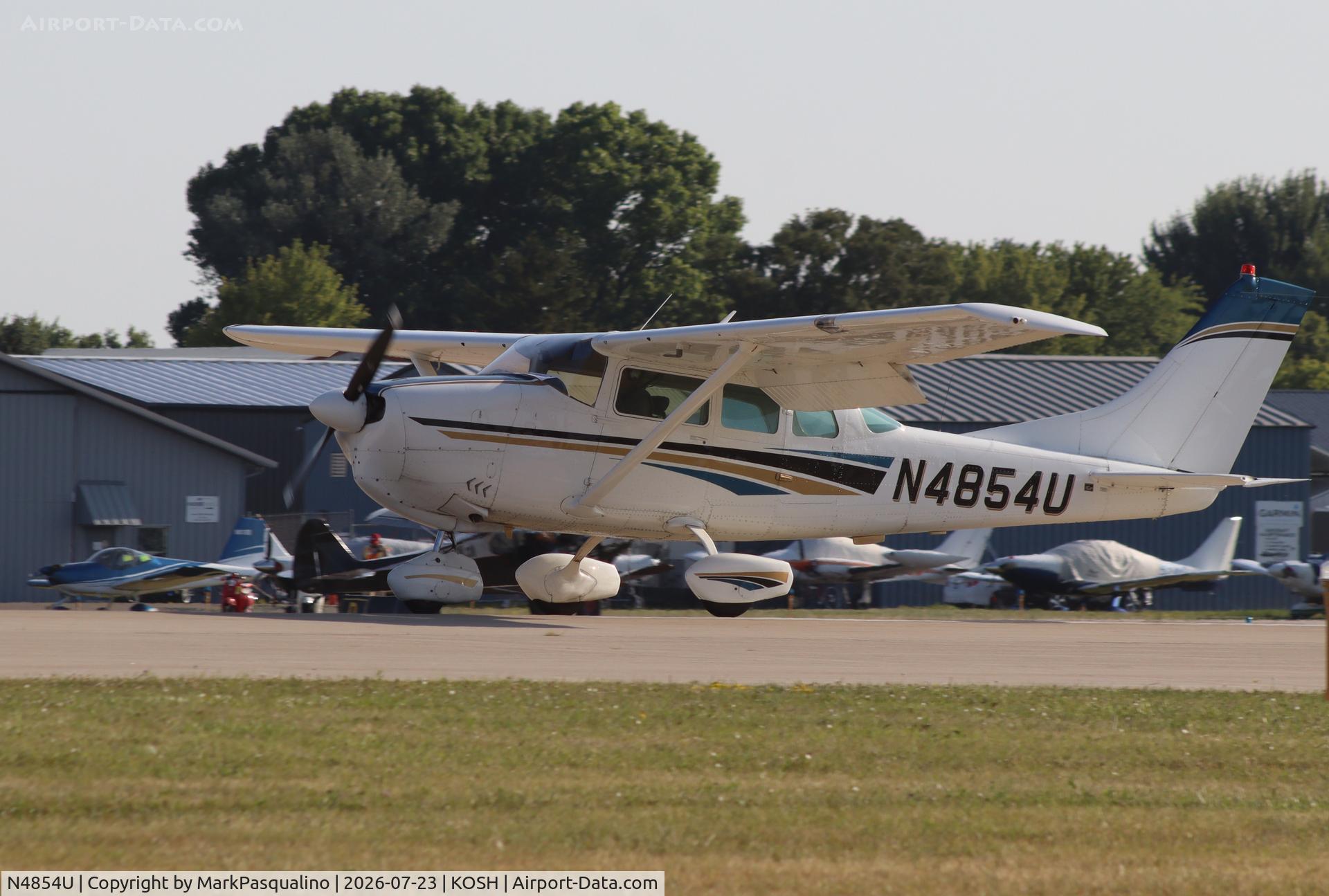 Aircraft N4854U, 1964 Cessna 210-5A (205A), c/n 205-0554, Cessna 205, at KOSH, photo by MarkPasqualino