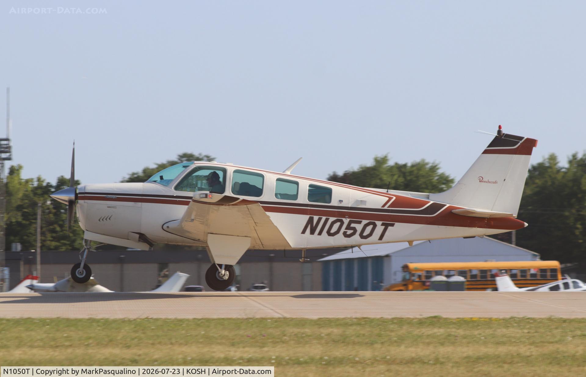 Aircraft N1050T, 1976 Beech A36 Bonanza 36, c/n E-881, Beech A36, at KOSH, photo by MarkPasqualino