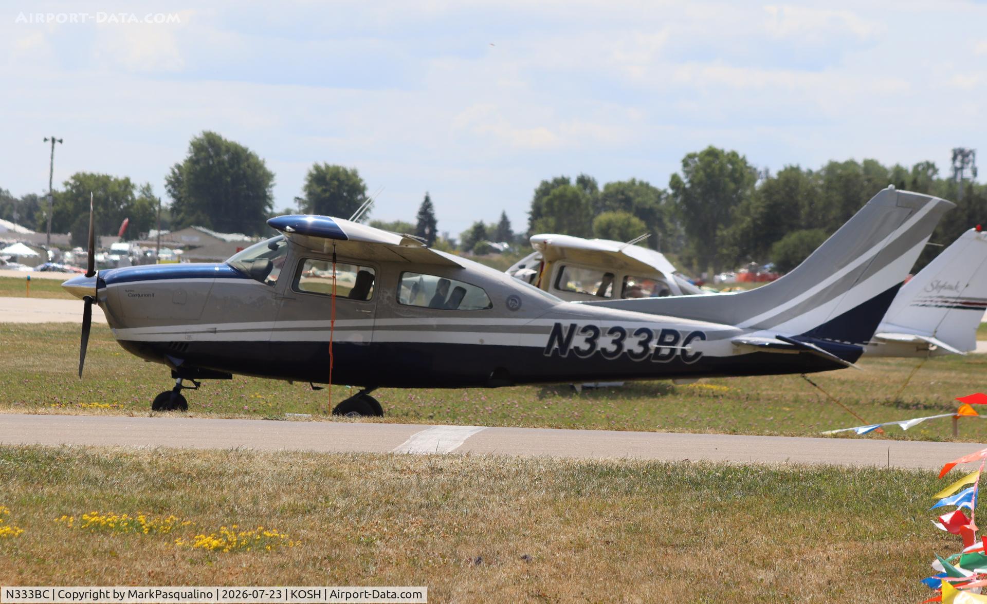 Aircraft N333BC, 1977 Cessna T210M Turbo Centurion, c/n 21061848, Cessna T210M, at KOSH, photo by MarkPasqualino