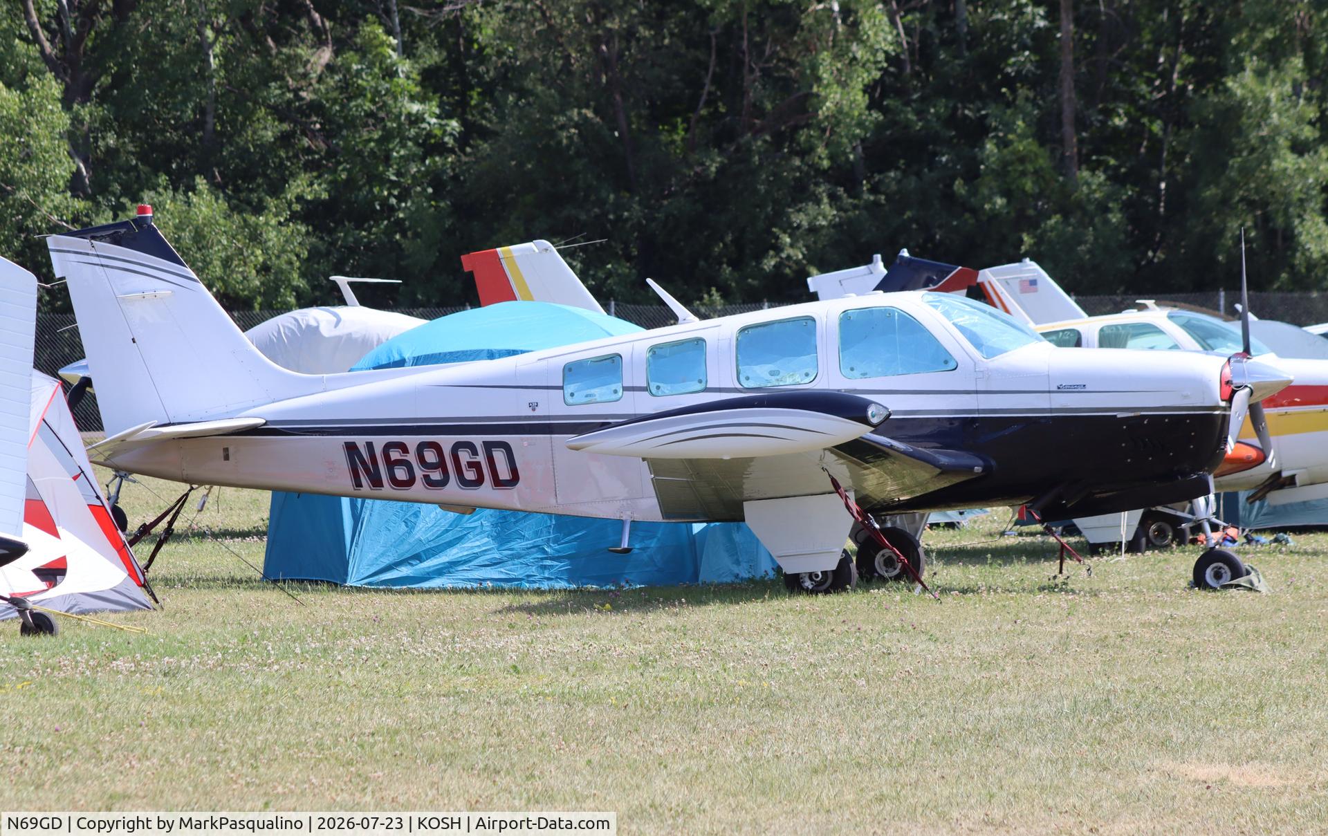 Aircraft N69GD, 1989 Beech A36 Bonanza 36, c/n E-2509, Beech A36, at KOSH, photo by MarkPasqualino