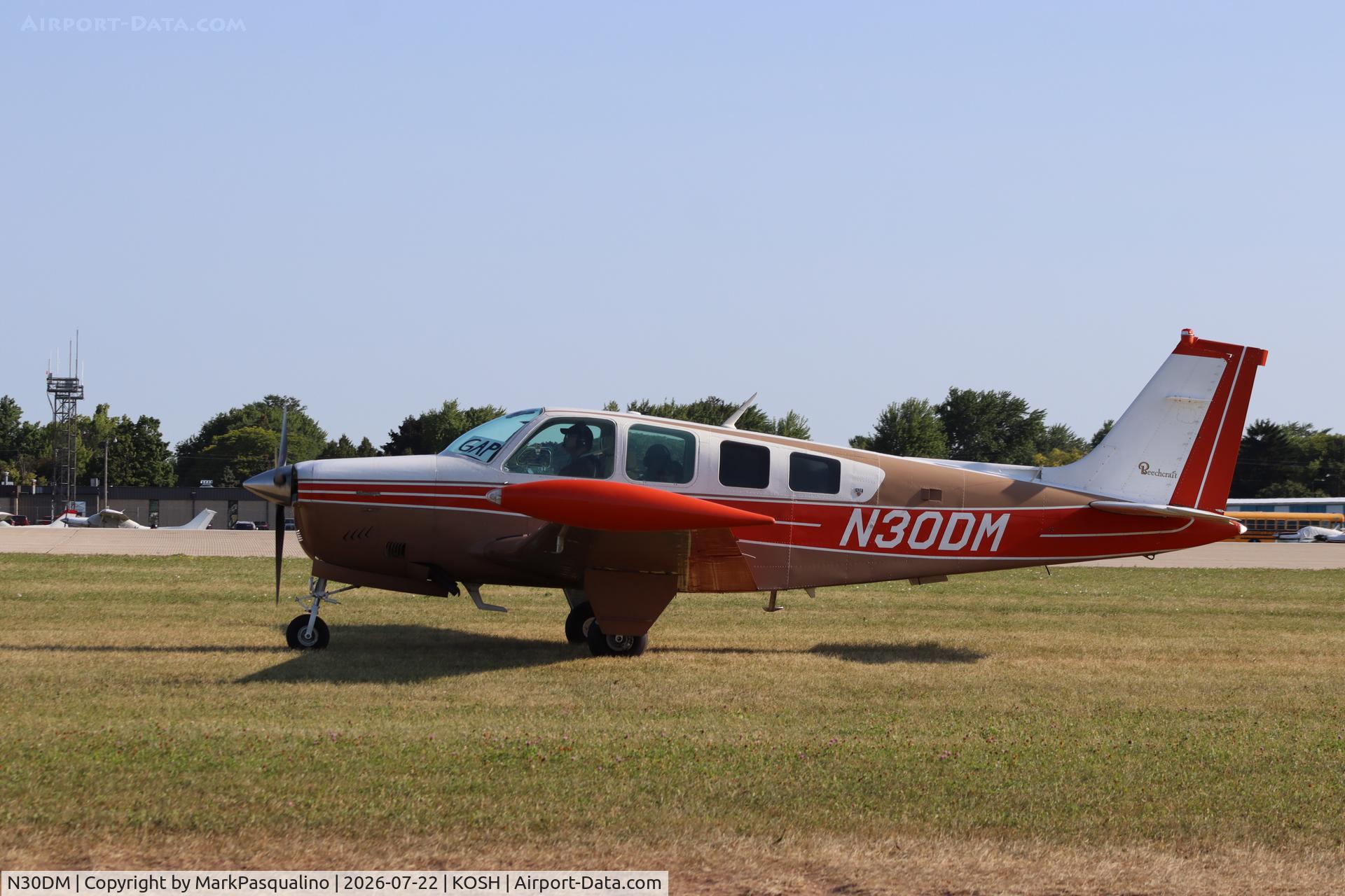 Aircraft N30DM, 1979 Beech A36 Bonanza 36, c/n E-1536, Beech A36, at KOSH, photo by MarkPasqualino