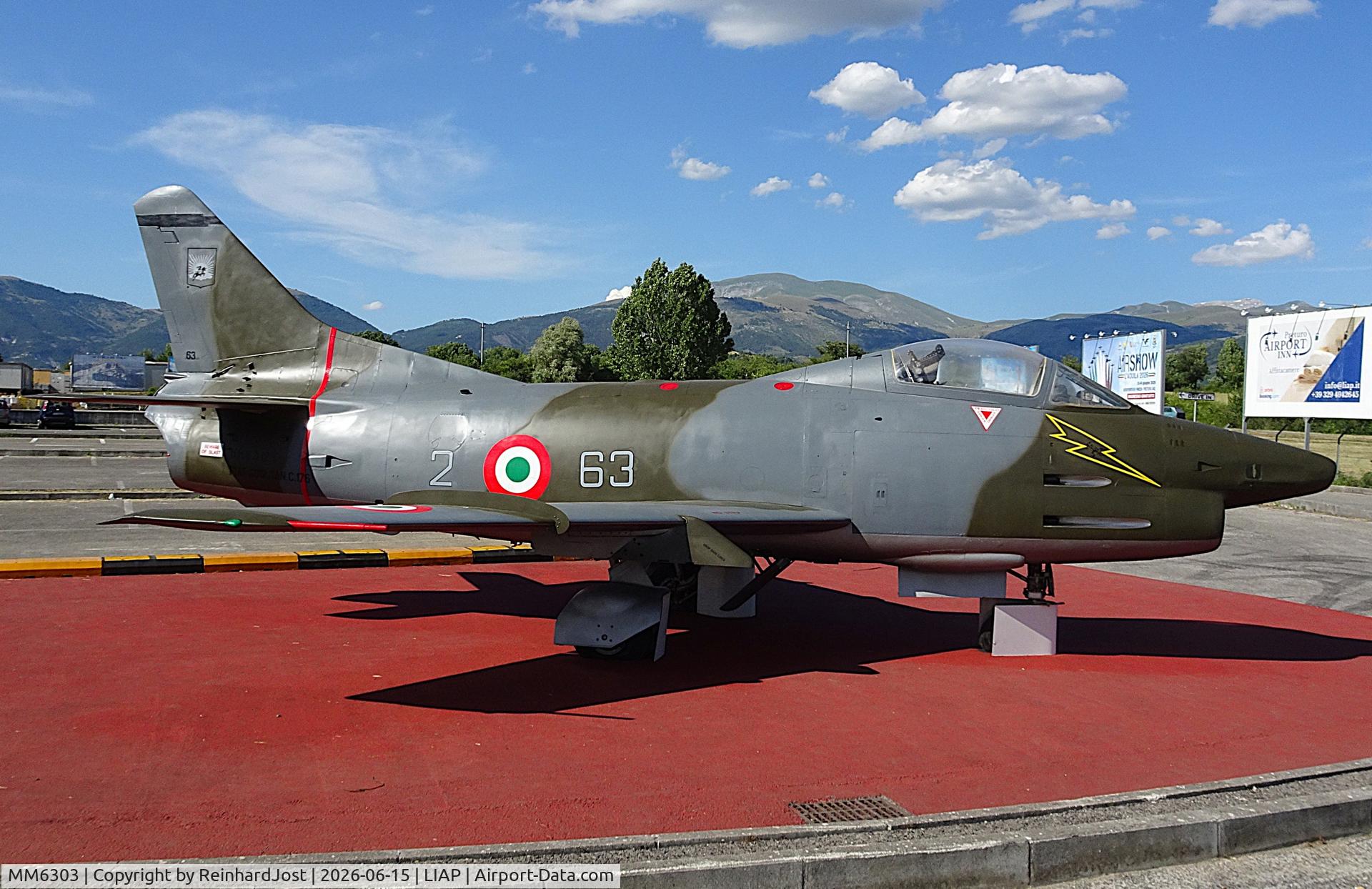 Aircraft MM6303, Fiat G-91R/1A, c/n 167, As Italian Air Force 63-1 on the roundabout in front of the airport L'Aquila, Italy, at LIAP, photo by ReinhardJost