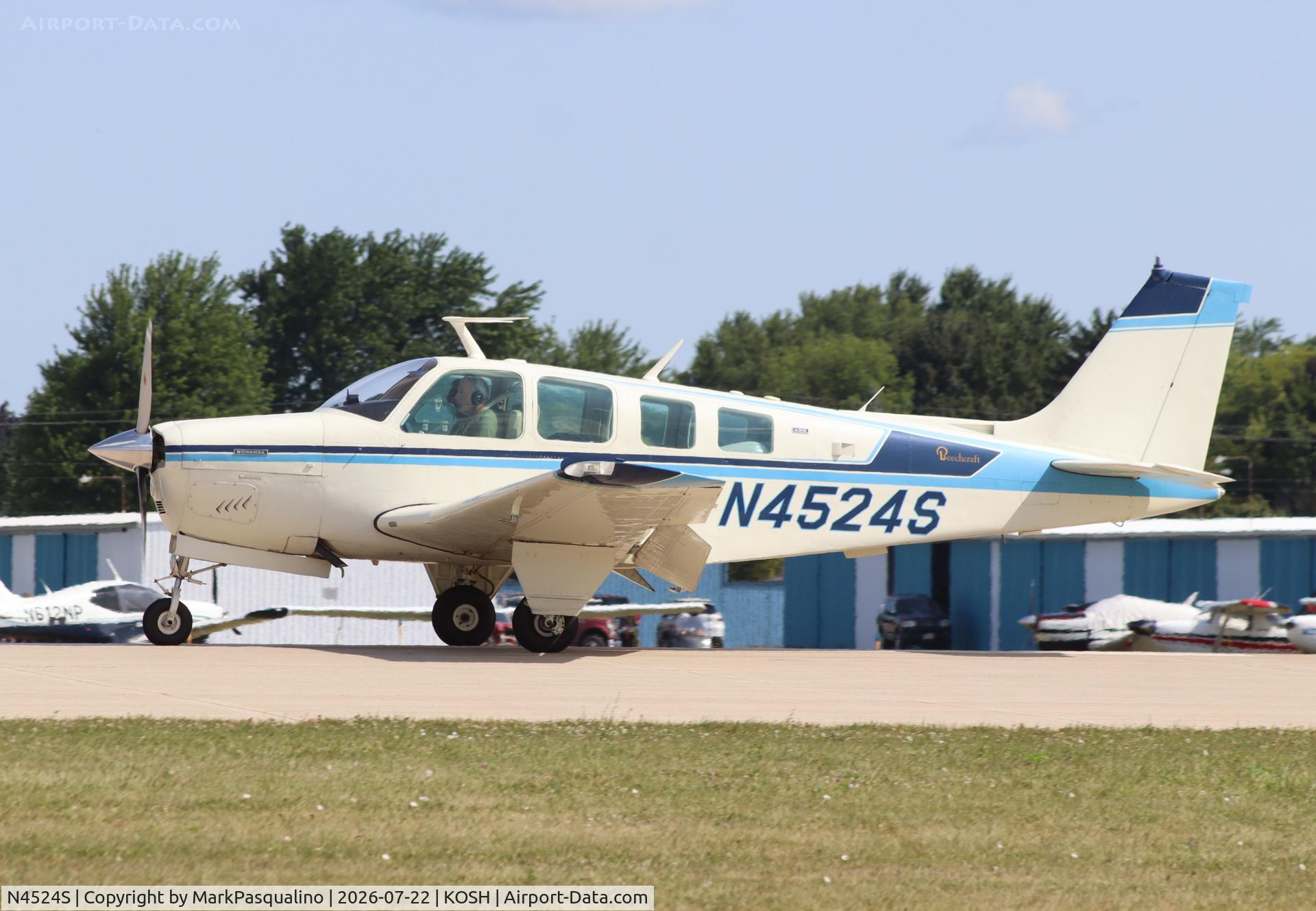 Aircraft N4524S, 1975 Beech A36 Bonanza 36, c/n E-727, Beech A36, at KOSH, photo by MarkPasqualino