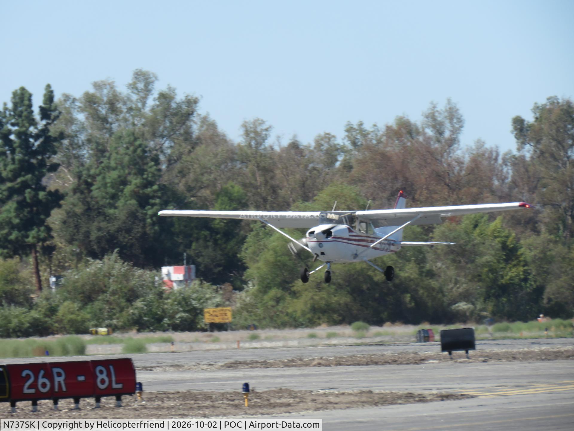 Aircraft N737SK, Cessna 172N, c/n 17269638, Landing 26R, at POC, photo by Helicopterfriend