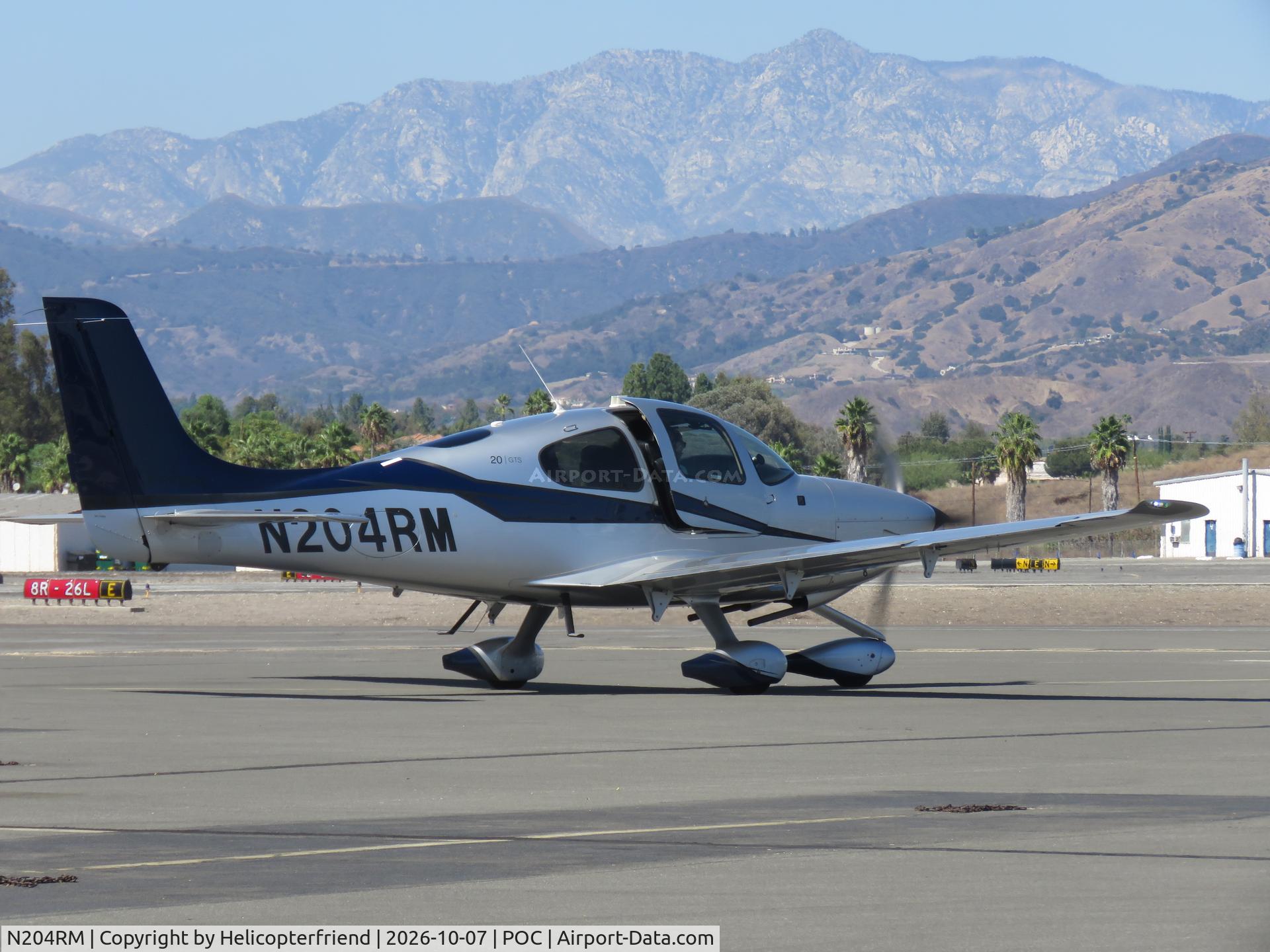 Aircraft N204RM, 2015 Cirrus SR20, c/n 2295, Holding short of taxiway Sierra, at POC, photo by Helicopterfriend